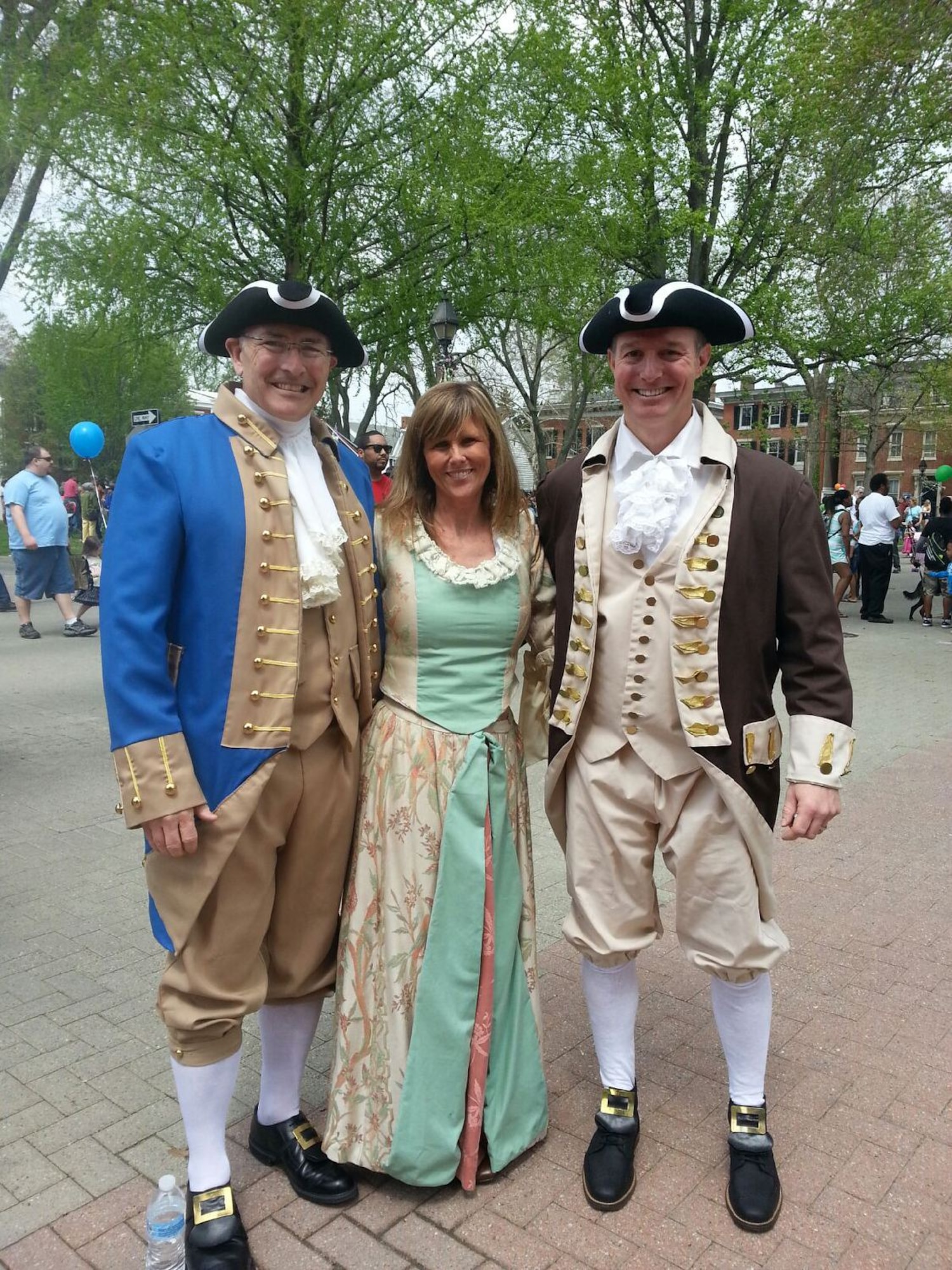 Col. Jonathan Philebaum, 512th Operations Group commander, and his wife, Joann, stand with Col. Randy Huiss, 436th Airlift Wing vice commander, during Dover Days May 3, 2014, in downtown Dover, Del. Huiss and Philebaum walked with the governor and mayor of Dover in the Dover Days parade. (Courtesy photo)