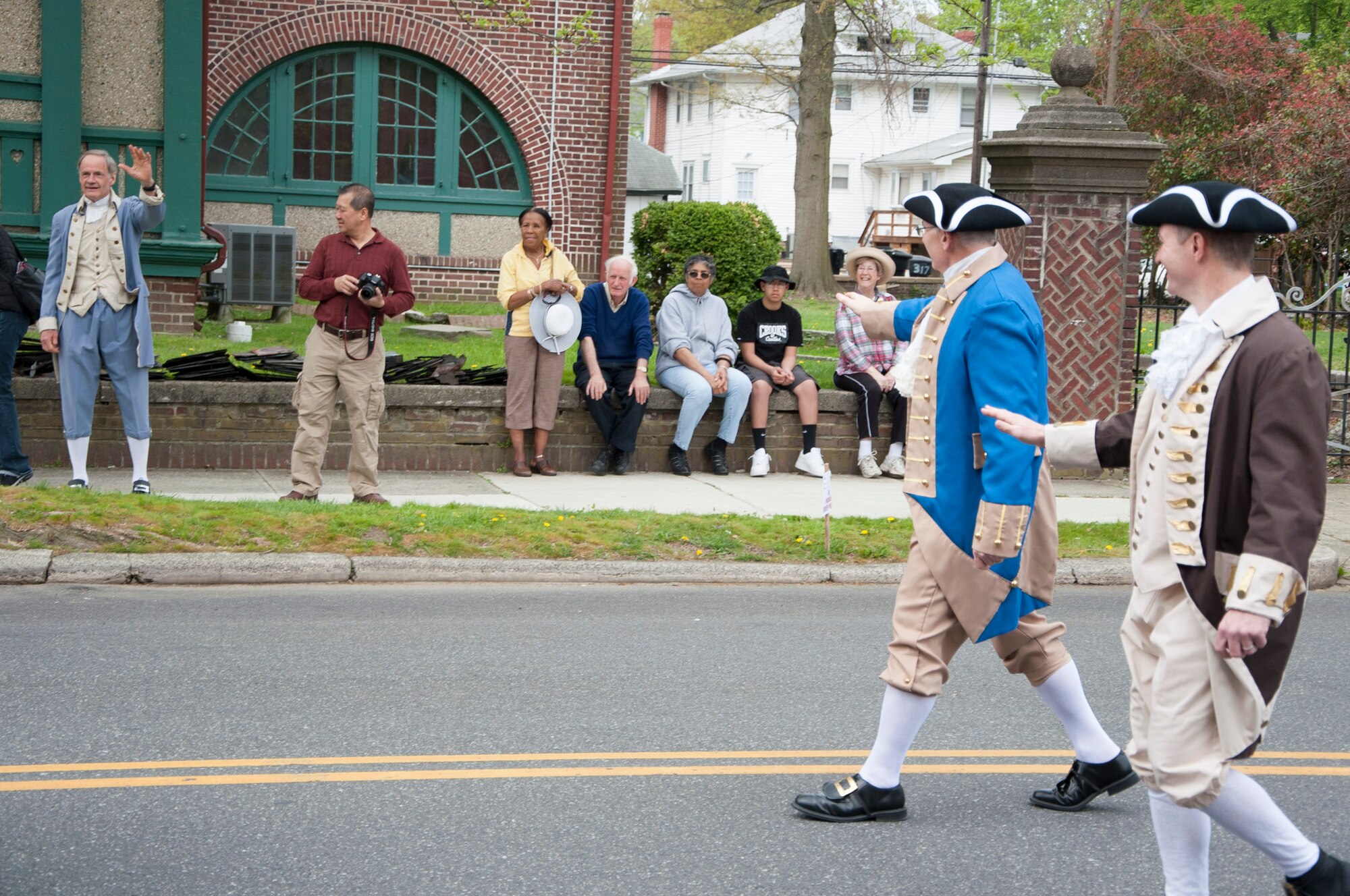 Col. Jonathan Philebaum, 512th Operations Group commander, and Col. Randy Huiss, 436th Airlift Wing vice commander, wave to Sen. Tom Carper, U.S. Senator from Delaware, during the Dover Days parade May 3, 2014, in downtown Dover, Del. The commanders walked behind the governor of Delaware and mayor of Dover in the 81st annual Dover Days parade. (U.S. Air Force photo/Senior Airman Jared Duhon) 