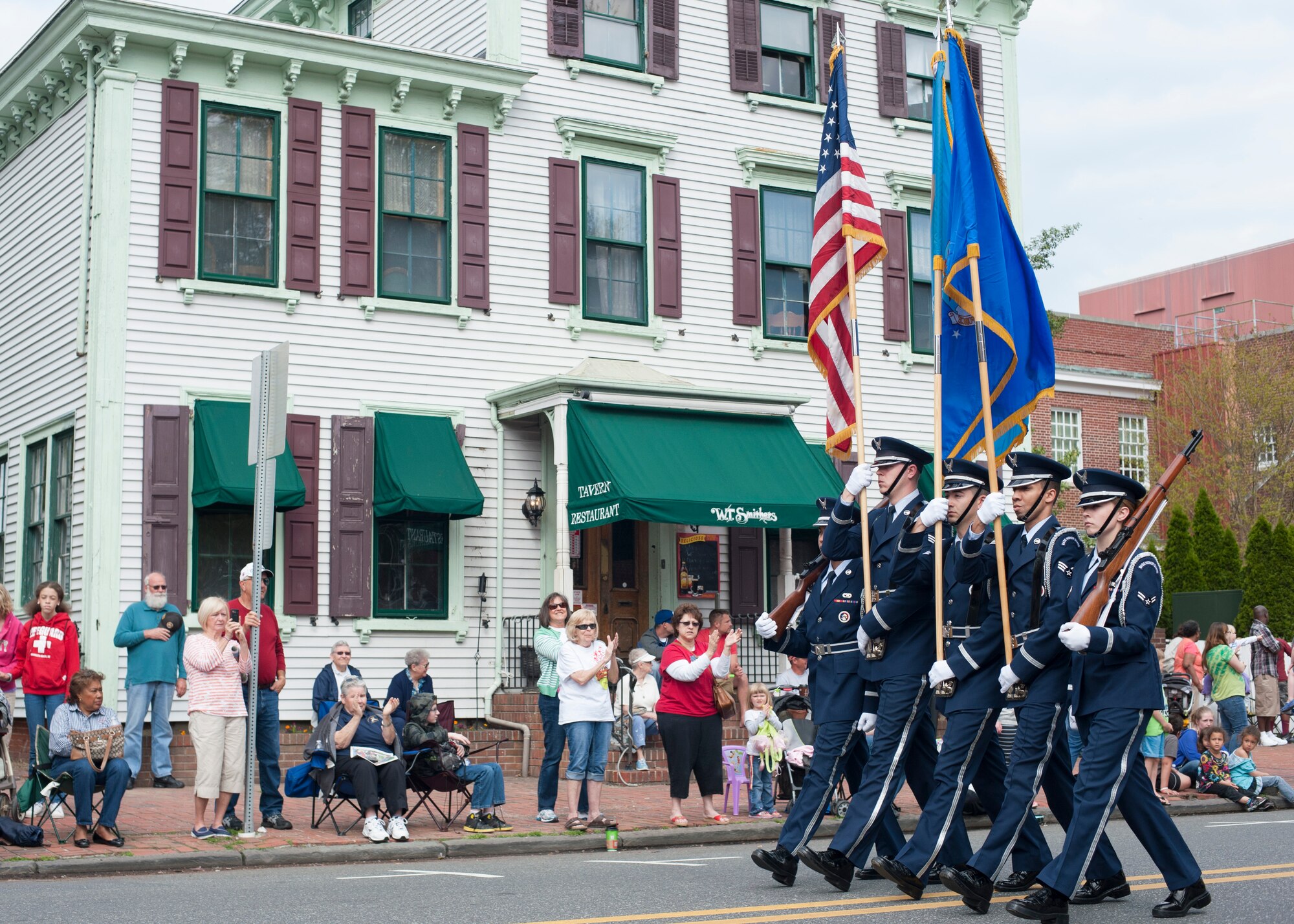 The Dover Air Force Base honor guard participates in the Dover Days parade May 3, 2014, in downtown Dover, Del. The parade showcased the heritage and history of the city of Dover.(U.S. Air Force photo/Senior Airman Jared Duhon)