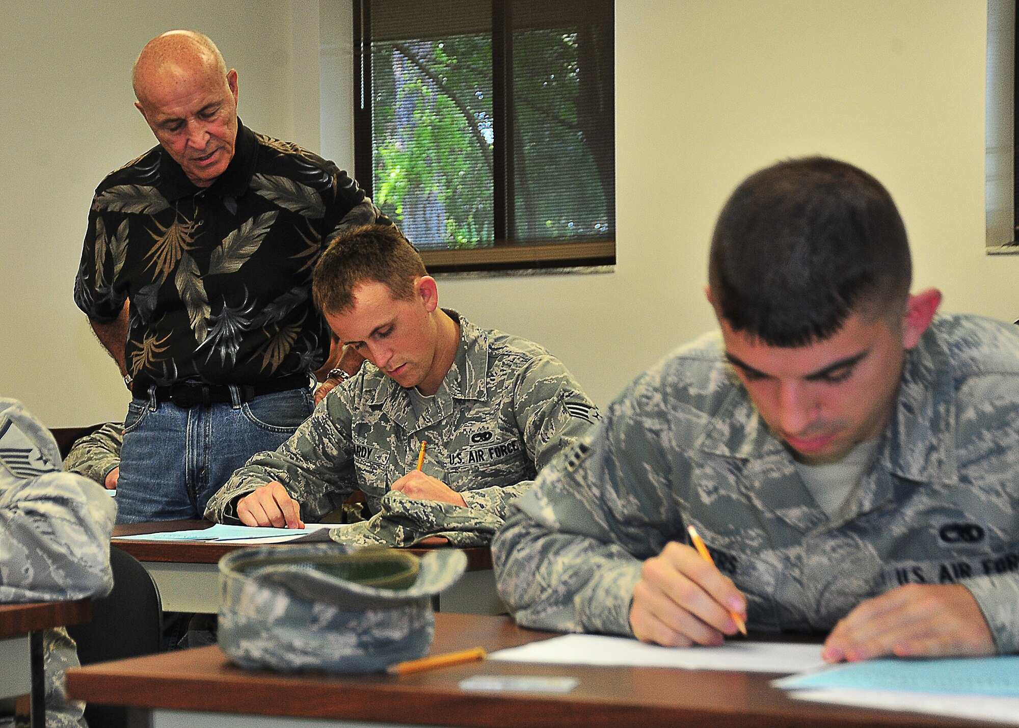 Gerald Havel, 325th Force Support Squadron test control officer, walks around the testing room May 6 at the Education Center. Havel makes sure Airmen understand what to fill out properly for their Weighted Airman Promotion System Test. (U.S. Air Force photo by Airman 1st Class Sergio A. Gamboa)