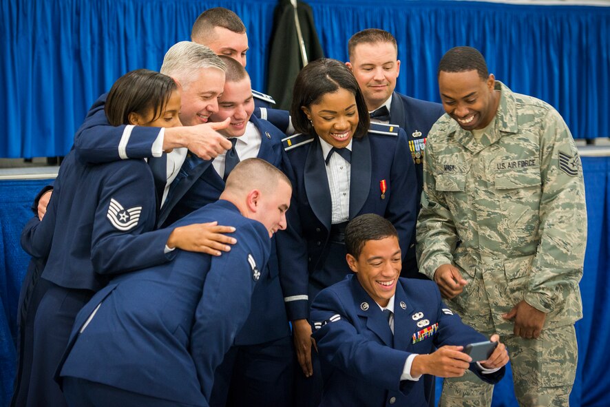 U.S. Air Force Brig. Gen. Kenneth Todorov, Joint Integrated Air and Missile Defense Organization director and former 23d Wing commander, takes a selfie during a dining-in at Moody Air Force Base, Ga., May 2, 2014. Todorov recognized several Moody Airmen during his speech and called them up for a group photo. (U.S. Air Force photo by Airman 1st Class Ryan Callaghan/Released)