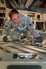 Senior Airman Paul Graf, 67th Aerial Port Squadron, secures a fire truck inside a C-17 Globemaster III at Grissom Air Reserve Base, Ind., during the Patriot Warrior exercise April 25. (U.S. Air Force photo/Tech. Sgt. Mark R. W. Orders-Woempner)