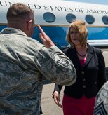 Chief Master Sgt. David Wade, 437th Maintenance Group superintendent, salutes Secretary of the Air Force Deborah Lee James as he welcomes her to Joint Base Charleston, S.C., May 6, 2014. James is the 23rd Secretary of the Air Force and was appointed to the position Dec. 20, 2013. She is responsible for the affairs of the Department of the Air Force, including organizing, training, equipping and providing for the welfare of its more than 690,000 active-duty, Guard, Reserve and civilian Airmen and their families. (U.S. Air Force photo/ Airman 1st Class Clayton Cupit)