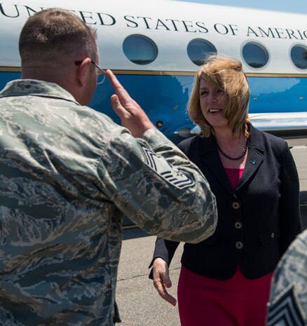 Chief Master Sgt. David Wade, 437th Maintenance Group superintendent, salutes Secretary of the Air Force Deborah Lee James as he welcomes her to Joint Base Charleston, S.C., May 6, 2014. James is the 23rd Secretary of the Air Force and was appointed to the position Dec. 20, 2013. She is responsible for the affairs of the Department of the Air Force, including organizing, training, equipping and providing for the welfare of its more than 690,000 active-duty, Guard, Reserve and civilian Airmen and their families. (U.S. Air Force photo/ Airman 1st Class Clayton Cupit)