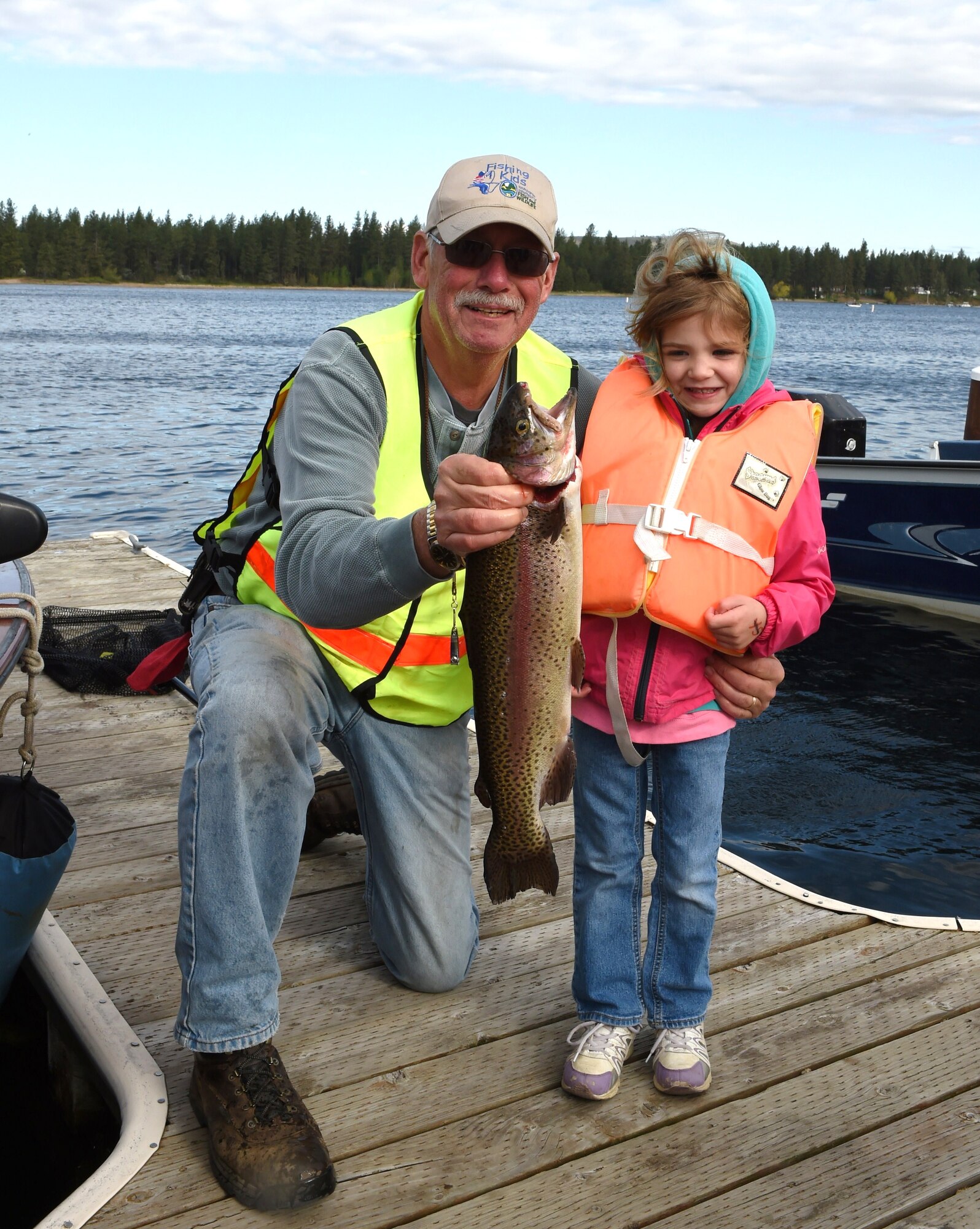Siena Rowles, daughter of U.S. Army Reserve Maj. Andrew Rowles, holds up a king-sized Rainbow Trout she caught during Fairchild Air Force Base Clear Lake’s opening day event in Cheney, Wash., April 26, 2014. Clear Lake Recreation Area provides fishing, water skiing, swimming and boating for off-duty Fairchild Air Force Base personnel, including active duty, retired military, National Guard, active members of the Reserves, Department of Defense civilian employees and family members. (Courtesy photo by Jerry Rowles)
