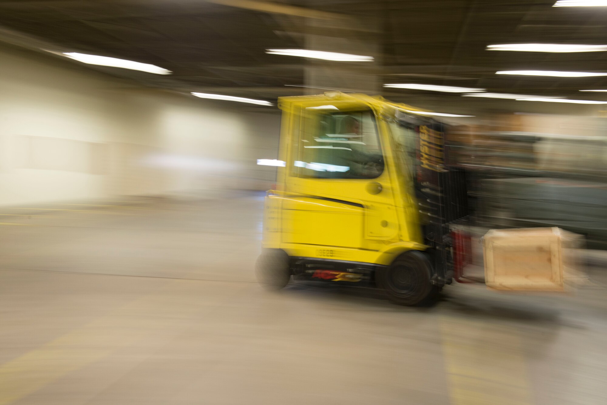 Airmen from the 5th Logistics Readiness Squadron traffic management office assemble crates and label cargo for shipment at Minot Air Force Base, N.D., April 30, 2014. TMO is responsible for packaging and shipping furnished goods to other bases around the world. In addition to receiving and shipping Airmen’s household goods, TMO also assists with the shipment and packaging of mission essential parts and components. (U.S. Air Force photo/Airman 1st Class Sahara L. Fales)