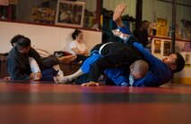 Members of the Minot Brazilian Jiu-Jitsu team practice techniques at Calavera Martial Arts and Boxing club in Minot, N.D., April 21, 2014. Eight members of the team will travel to Minneapolis in May to compete in a national tournament. (U.S. Air Force photo/Airman 1st Class Apryl Hall)
