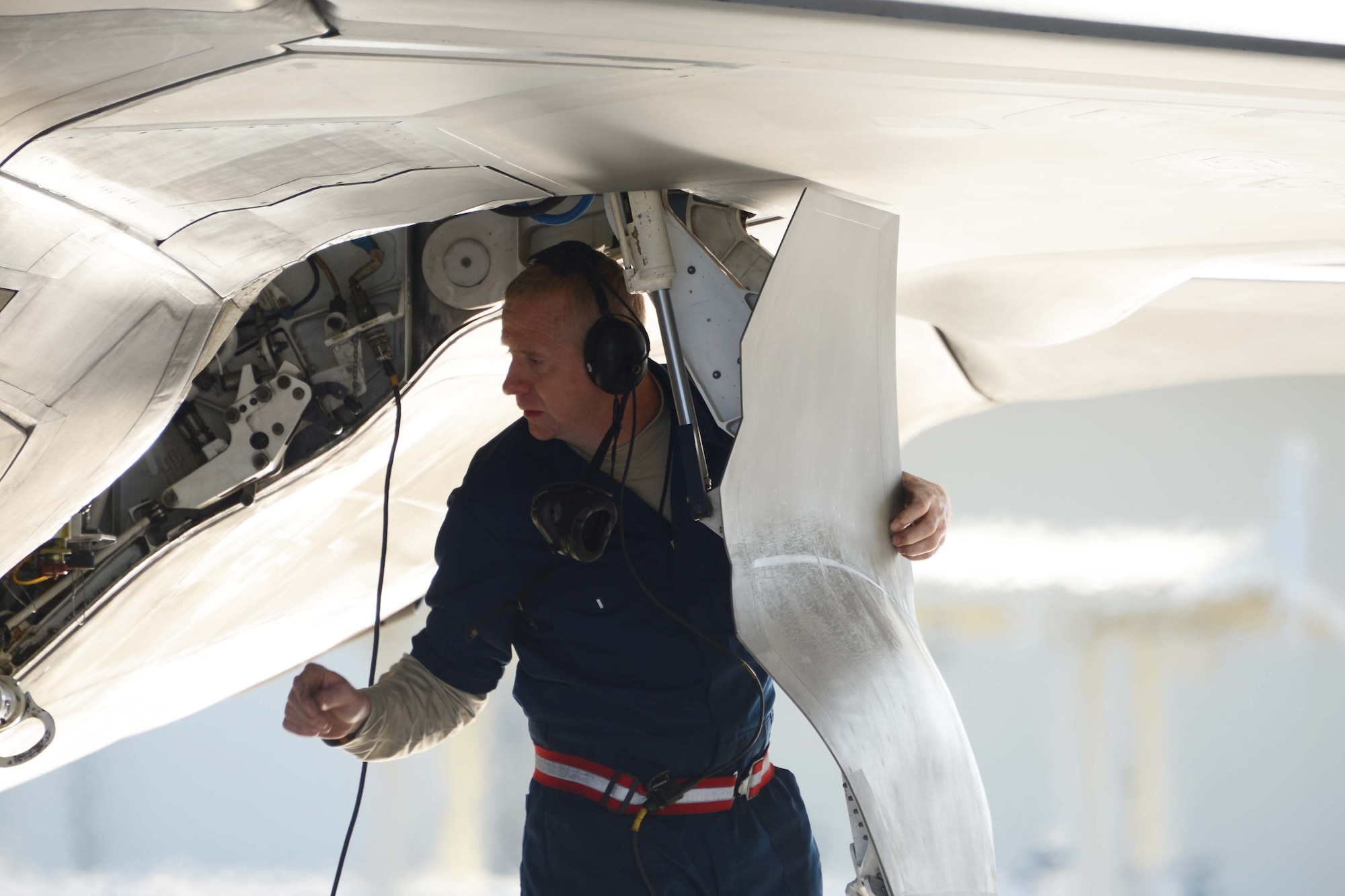 Staff Sgt. Bernard Taft, 477th Aircraft Maintenance Squadron crew chief, completes a pre-flight inspection on an F-22 here May 3. During the Reserve Unit Training Assembly weekend four F-22 pilots flew the most experienced four-ship flight in the history of the F-22.  (U.S. Air Force Photo/ Tech. Sgt. Dana Rosso) 