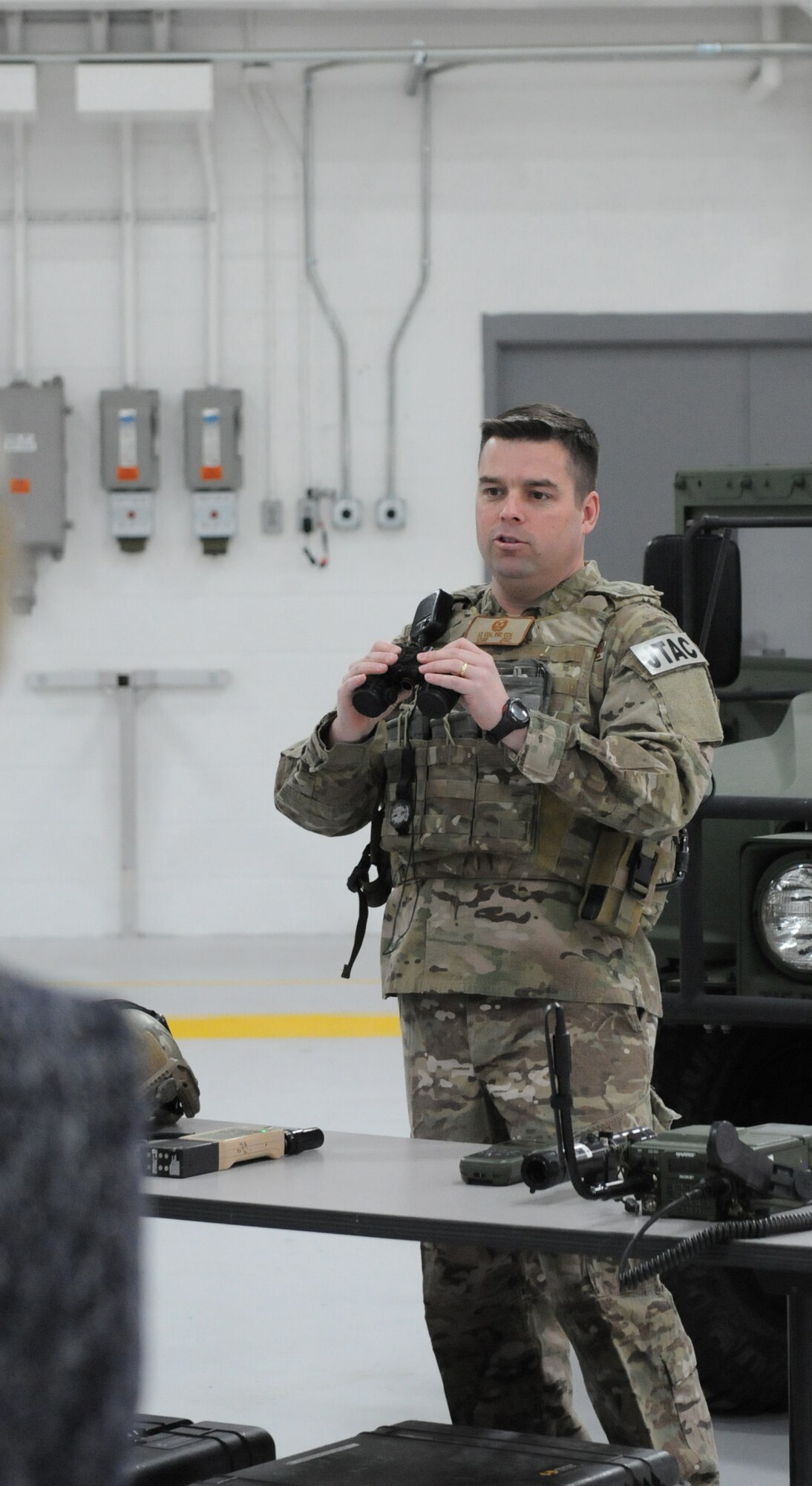 Lt. Col. Patrick Cox, Commander of the 274th Air Support Operations Squadron, explains the mission of the 274th ASOS to members of the Hancock Field Military Advisory Council 6 May 2014. The council was here in support of strengthening the 174th Attack Wing in the community. (New York Air National Guard Photo By Senior Airman Duane Morgan)