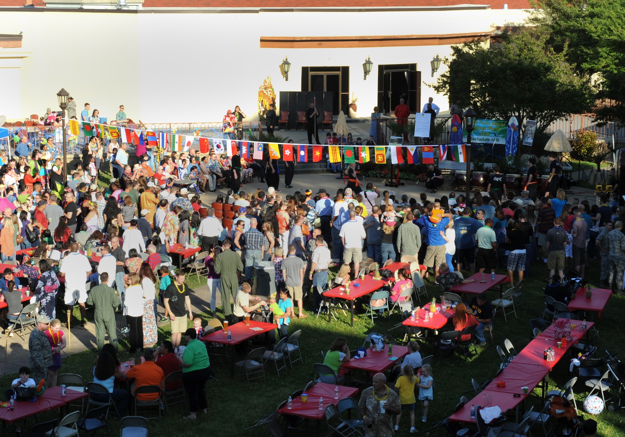 Team Barksdale members celebrate the Asian-Pacific Heritage-Fest Luau on Barksdale Air Force Base, La., May 2, 2014. The audience was treated to performances by Indian and Philippine dance groups, Taiko drummers and Polynesian fire and knife dances. (U.S. Air Force photo/Senior Airman Benjamin Gonsier)