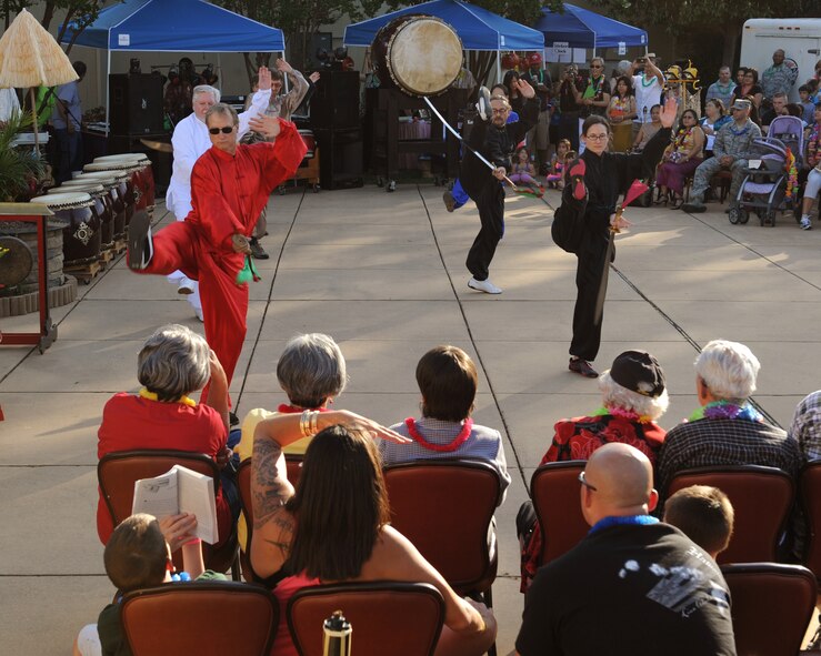 Kung Fu and Tai Chi performers demonstrate their maneuvers to Team Barksdale during the Asian-Pacific Heritage-Fest Luau on Barksdale Air Force Base, La., May 2, 2014. Kung Fu and Tai Chi are a form of Chinese martial arts. The martial arts were taught in Ancient China because there was a need for self-defense, proper hunting techniques and military training. (U.S. Air Force photo/Senior Airman Benjamin Gonsier)