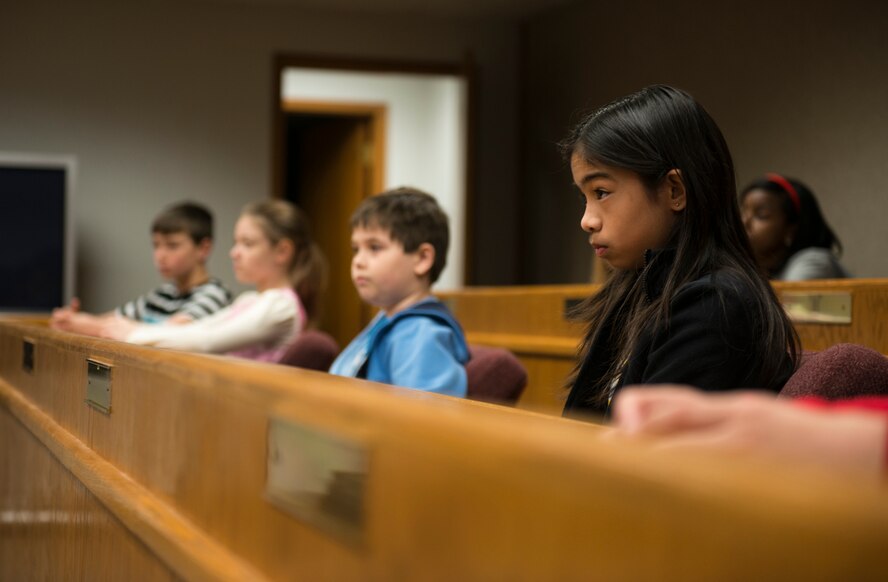 Sixth grade students from North Plains Elementary School participate in Minot Air Force Base’s Law Day celebration hosted by the 5th Bomb Wing Legal Office, May 1, 2014. While participating in a mock trial, twelve students sat in as the jury during the civil case of “Paul Bunyan vs. the state.” (U.S. Air Force photos/Airman 1st Class Lauren Pitts) 