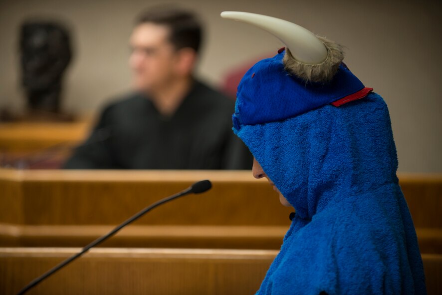 Babe the Big Blue Ox is called to the witness stand during the mock trial of “Paul Bunyan vs. the state” during the 5th Bomb Wing Legal Office Law Day celebration at Minot Air Force Base, N.D., May 1, 2014. Reading from a scripted testimony, the Legal Office performed the mock trial with help from a sixth grade class from North Plains Elementary school, and explained the importance of the legal system. (U.S. Air Force photos/Airman 1st Class Lauren Pitts) 