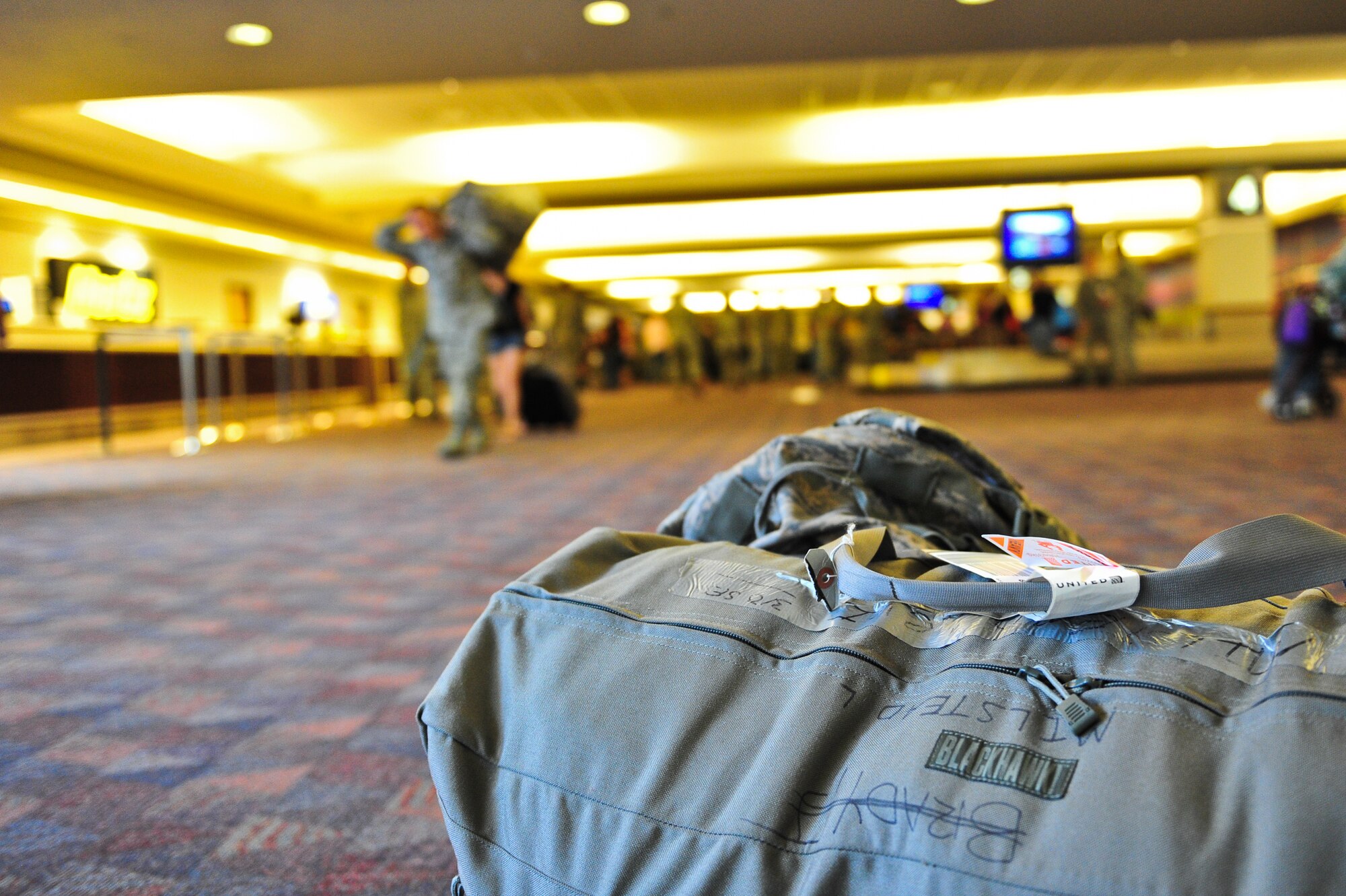 Pieces of luggage sit waiting as Air Force Reserve Security Forces Airmen arrive home from Southwest Asia May 3, 2014, at the Colorado Spring Airport in Colorado Springs, Colo. A number of the Reservists, assigned to the 310th Security Forces Squadron, provided integrated base defense, physical security and antiterrorism and force protection measures on behalf of U.S. and allied personnel at the Manas Transit Center in the Kyrgyz Republic.
(U.S. Air Force photo/Tech. Sgt. Nicholas B. Ontiveros)