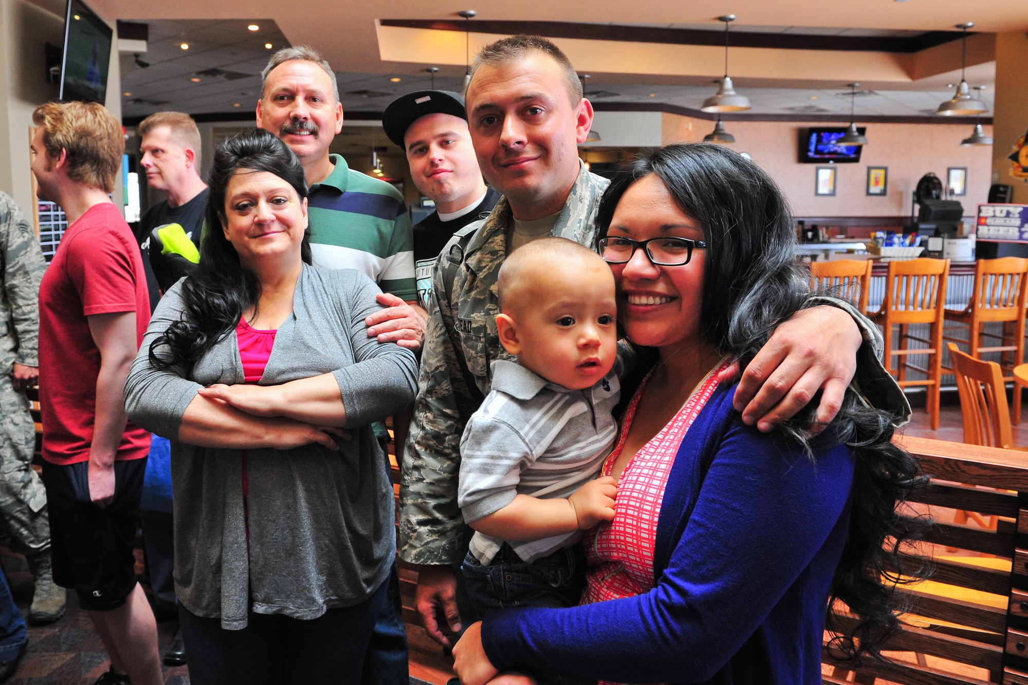 Air Force Reserve Senior Airman Levi Milstead embraces his family after returning from Southwest Asia May 3, 2014, at the Colorado Spring Airport in Colorado Springs, Colo. Milstead and nearly 15 other AF Reservists assigned to the 310th Security Forces Squadron provided integrated base defense, physical security and antiterrorism and force protection measures on behalf of U.S. and allied personnel at the Manas Transit Center in the Kyrgyz Republic.
(U.S. Air Force photo/Tech. Sgt. Nicholas B. Ontiveros)