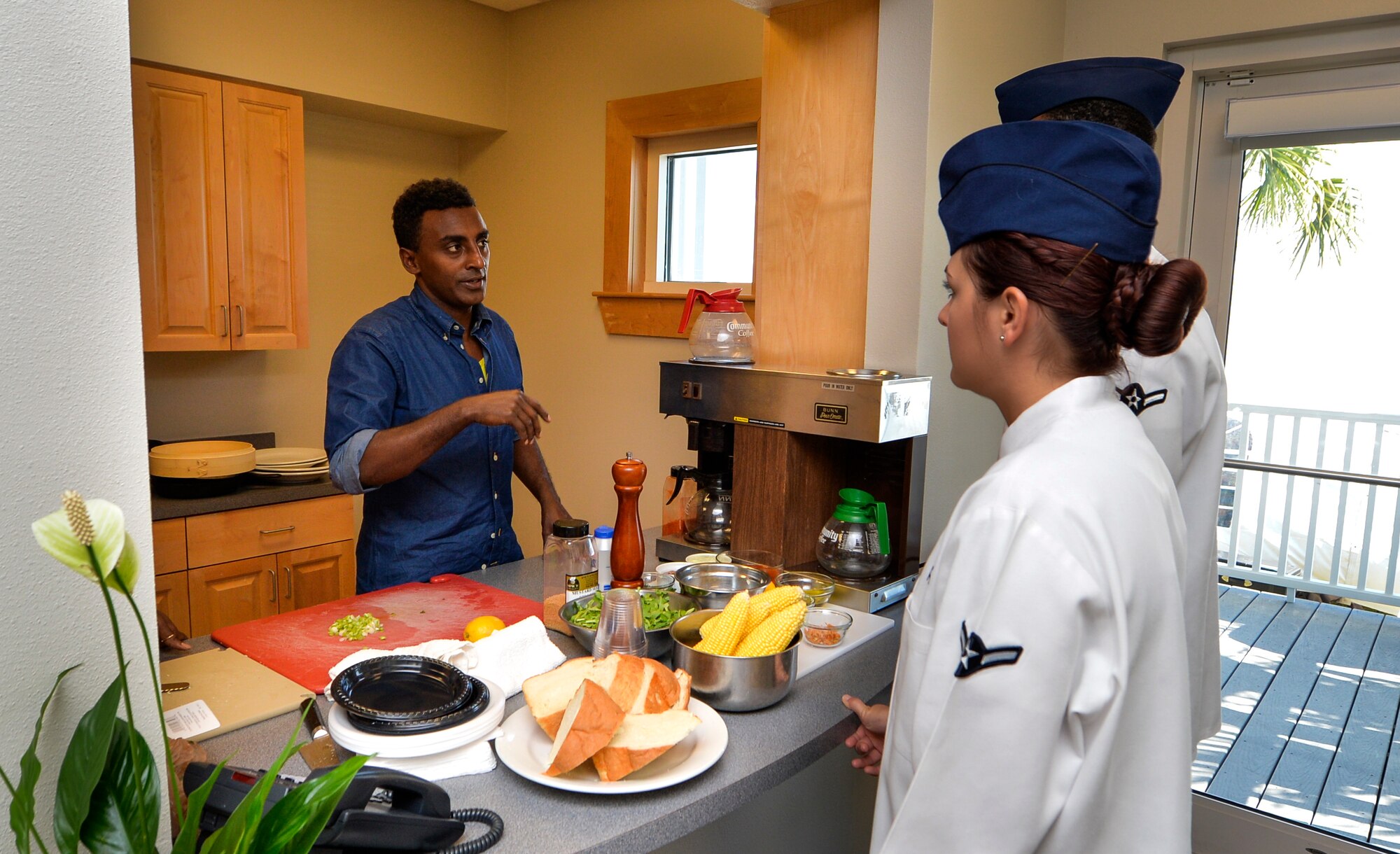 Airmen Gary Strong and Alyssa Ross, 1st Special Operations Force Support Squadron food service specialists, learn from professional chefs at the Taste of Navarre in Navarre, Fla., May 4, 2014. The Airmen met chefs from the local area, as well as Marcus Samuelsson, an award-winning chef. (U.S. Air Force photo/Senior Airman Christopher Callaway) 