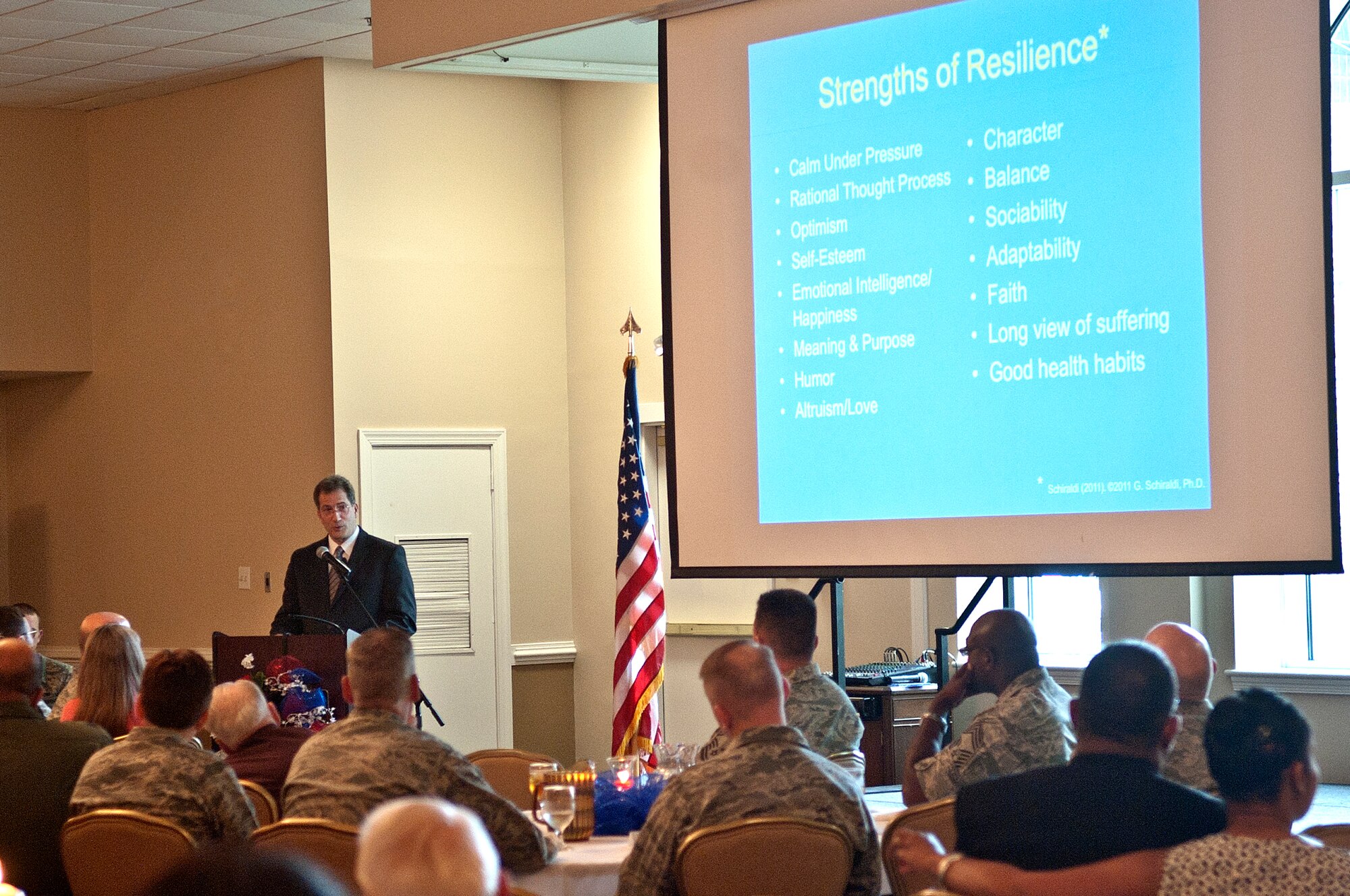 Dr. Glenn Schiraldi, University of Maryland School of Public Health psychology professor and guest speaker, speaks to Team Seymour Members about the importance of resilience during the National Prayer luncheon, May 2, 2014, at Seymour Johnson Air Force Base, N.C. Schiraldi shared stories of the resilience of combat survivors and prisoners of war about resiliency. (U.S. Air Force photo/Airman 1st Class Shawna L. Keyes) 