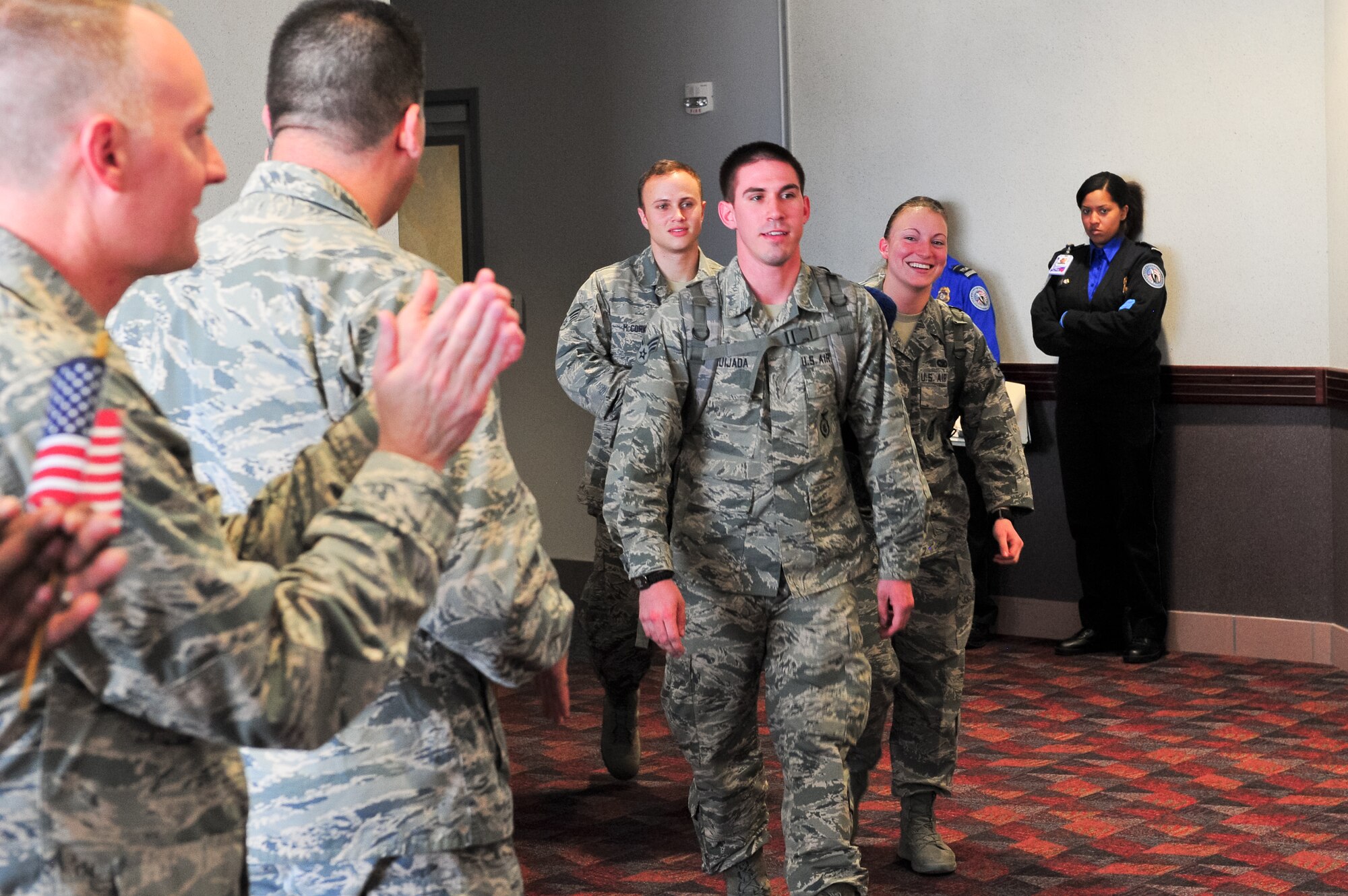 Air Force Reserve Security Forces Airmen return home from Southwest Asia May 3, 2014, at the Colorado Spring Airport in Colorado Springs, Colo. A number of the Reservists, assigned to the 310th Security Forces Squadron, provided integrated base defense, physical security and antiterrorism and force protection measures on behalf of U.S. and allied personnel at the Manas Transit Center in the Kyrgyz Republic. (U.S. Air Force photo/Tech. Sgt. Nicholas B. Ontiveros)