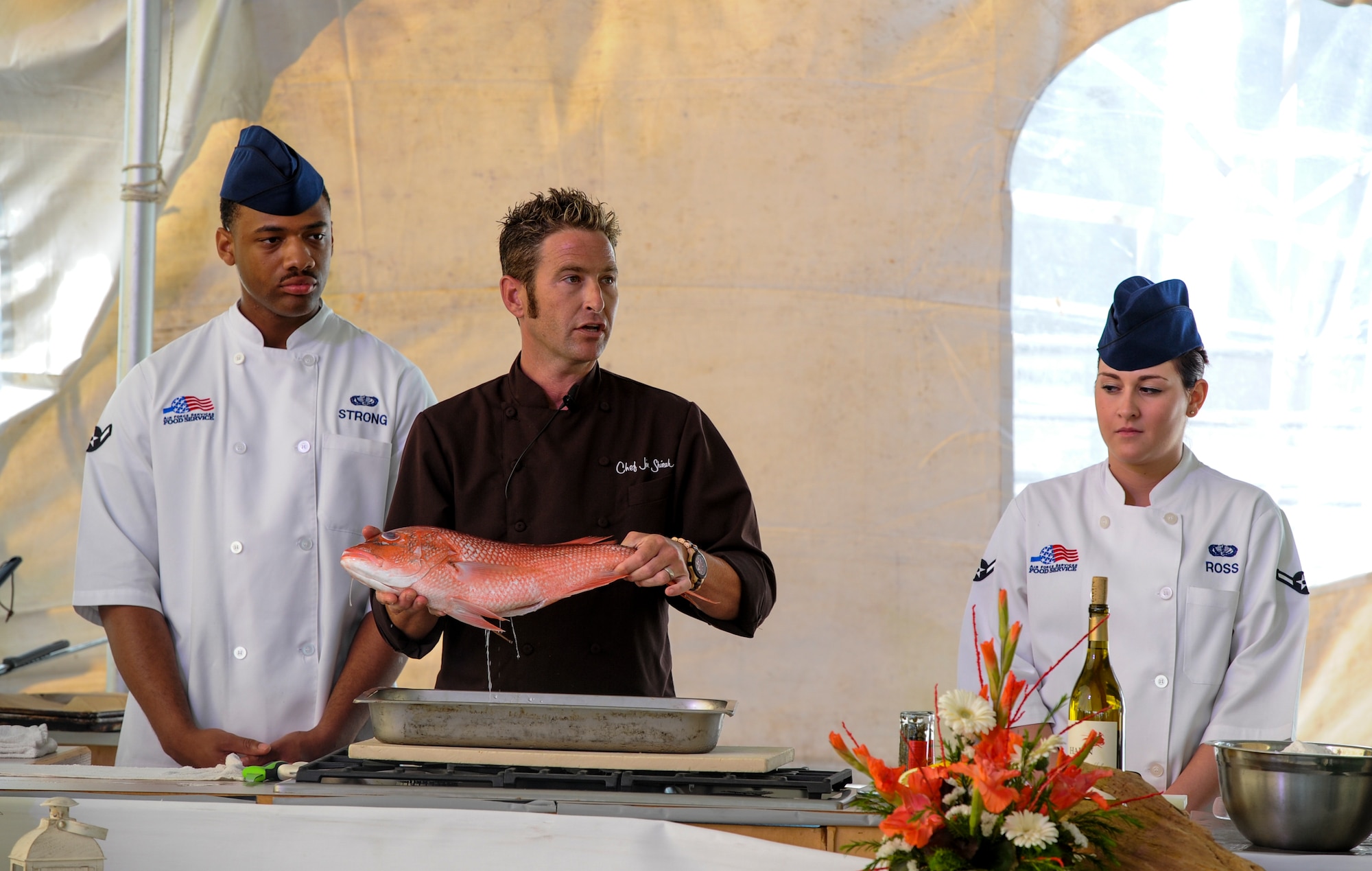 Airmen Gary Strong and Alyssa Ross, 1st Special Operations Force Support Squadron food service specialists, learn from professional chefs at the Taste of Navarre in Navarre, Fla., May 4, 2014. (U.S. Air Force photo/Senior Airman Christopher Callaway) 
