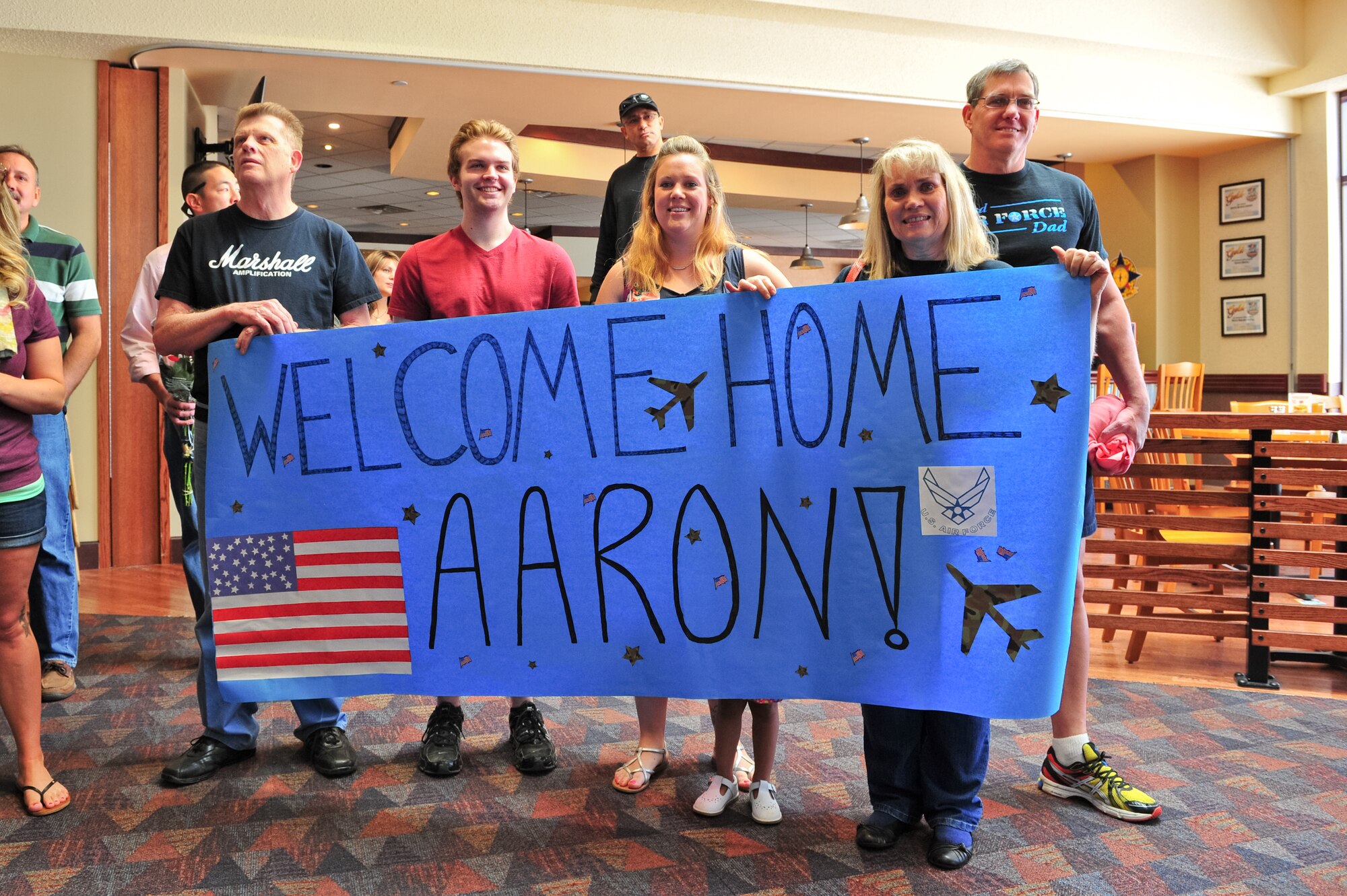 Family members show support for their Air Force Reserve Security Forces Airmen's return from Southwest Asia May 3, 2014, at the Colorado Spring Airport in Colorado Springs, Colo. A number of the Reservists, assigned to the 310th Security Forces Squadron, provided integrated base defense, physical security and antiterrorism and force protection measures on behalf of U.S. and allied personnel at the Manas Transit Center in the Kyrgyz Republic.
(U.S. Air Force photo/Tech. Sgt. Nicholas B. Ontiveros)