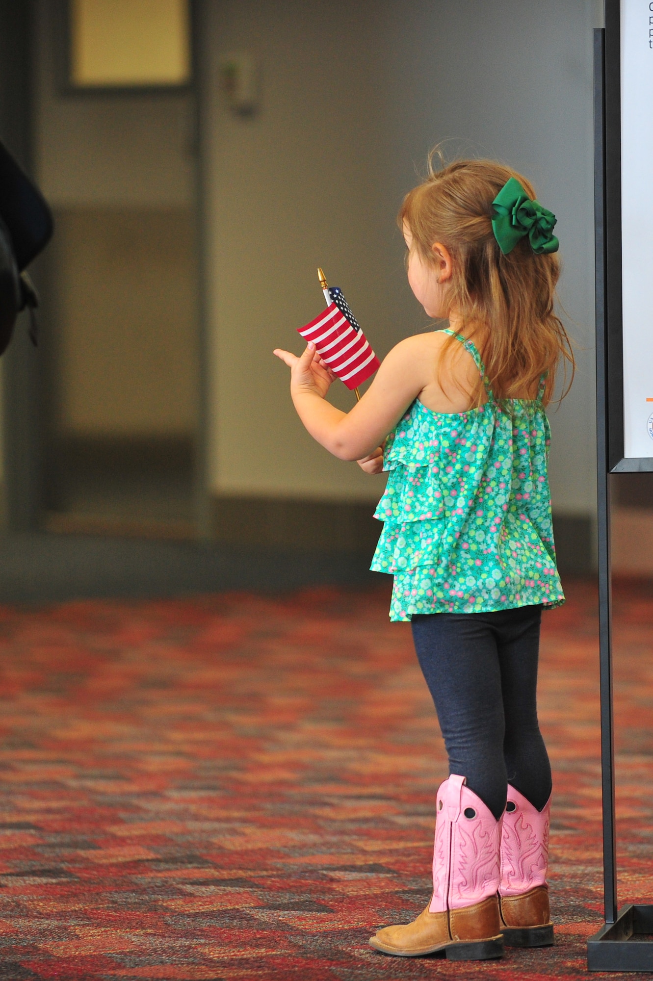 A daughter of an Air Force Reserve Security Forces Airman awaits her father's return from Southwest Asia May 3, 2014, at the Colorado Spring Airport in Colorado Springs, Colo. A number of the Reservists, assigned to the 310th Security Forces Squadron, provided integrated base defense, physical security and antiterrorism and force protection measures on behalf of U.S. and allied personnel at the Manas Transit Center in the Kyrgyz Republic.
(U.S. Air Force photo/Tech. Sgt. Nicholas B. Ontiveros)