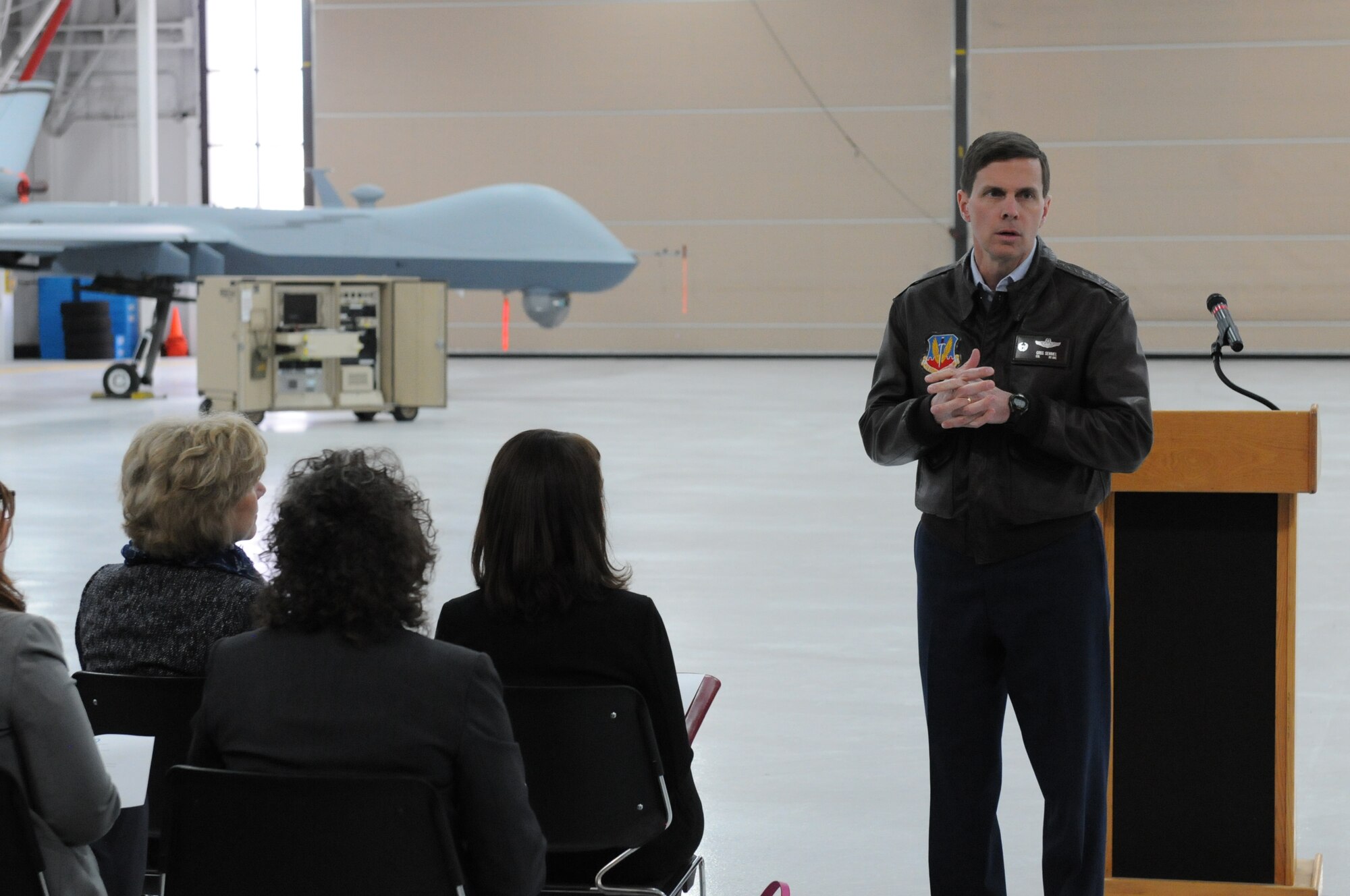 Col. Greg Semmel, Commander of the 174th Attack Wing, addresses the Hancock Field Military Advisory Council from Centerstate CEO during a briefing 6 May 2014. The council was here to help Hancock Field build strength in the community. (New York Air National Guard Photo By Senior Airman Duane Morgan)
