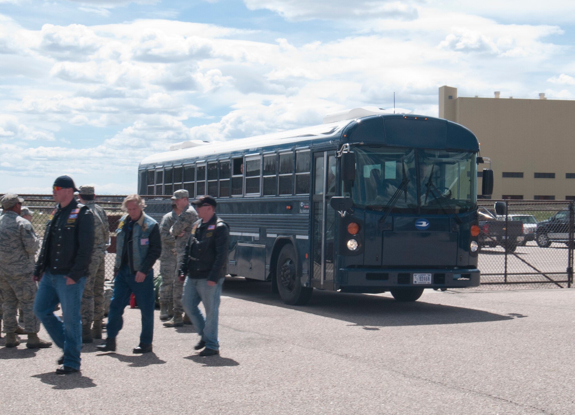 A bus carrying 90th Civil Engineer Squadron Airmen returning from a six-month deployment to Southwest Asia enters the courtyard outside Building 328 on F.E. Warren Air Force Base, Wyo., where the returning Airmen’s friends and loved ones await their arrival May 2, 2014. (U.S. Air Force photo by Airman 1st Class Jason Wiese)