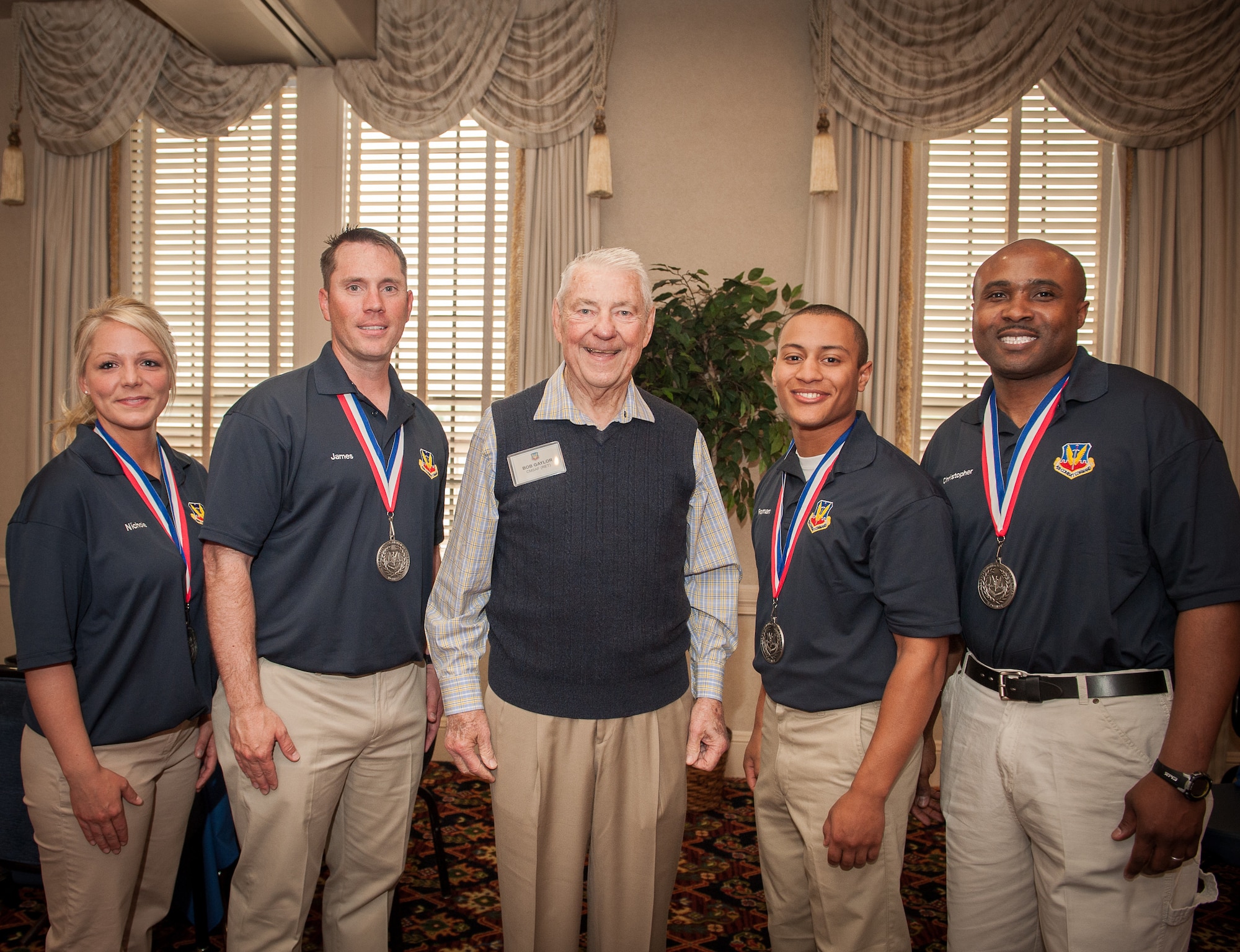 Four of the six Air Combat Command Outstanding Airmen of the Year pose with the fifth Chief Master Sergeant of the Air Force (Ret.) Robert D. Gaylor at the Langley Club on Joint Base Langley-Eustis 22 Apr. (U.S. Air Force photo by Sachel Simone/Released)