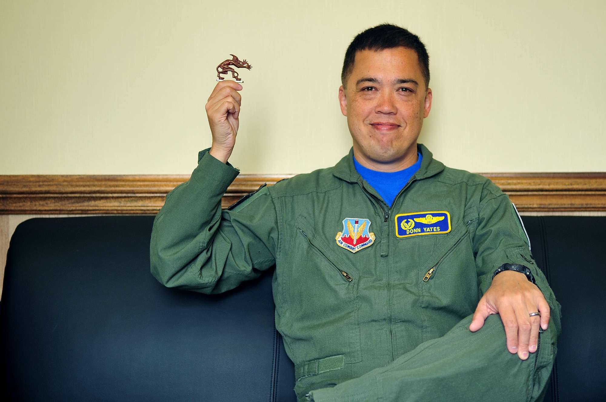 Lt. Col. Donn Yates, 334th Fighter Squadron commander, with "The Gremlin", May 2, 2014, at Seymour Johnson Air Force Base, N.C. The Gremlin was employed during World War II by Royal Air Force Pilot Officer James Harrington as a good luck charm in flight. (U.S. Air Force photo/Airman 1st Class Shawna Keyes)