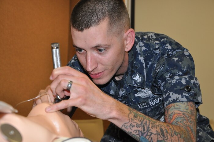 Hospital Corpsman Zachary Phipps intubates a dummy during the Naval Health Clinic Charleston Nurse Skills-a-thon May 1, 2014 at the NHCC on Joint Base Charleston – Weapons Station, S.C. Medical personnel from NHCC, the 628th Medical Group and Naval Hospital Beaufort participated in the Skills-a-thon, a joint training event designed for healthcare providers to brush up on their medical knowledge and skills. (U.S. Navy photo/Petty Officer 3rd Class Caralyn Mulyk)
