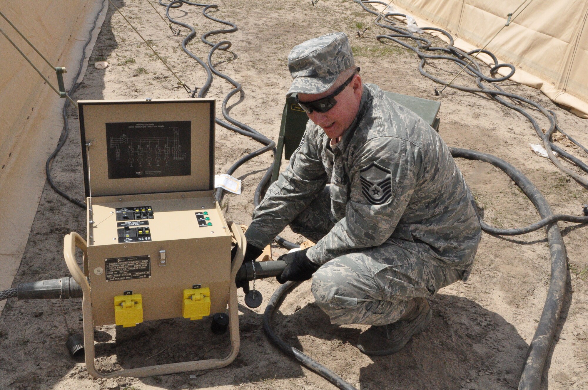 Master Sgt. Curtis Wilson, a 433rd Civil Engineer Electrician checks equipment during the sustainment phase of Exercise Patriot Warrior at Fort McCoy, Wisconsin May 5. The Alamo Wing Reservists out of Joint Base San Antonio arrived here April 26 to bed down a Forward Operating Base. (U.S. Air Force photo by 1st Lt. Denise Haeussler)