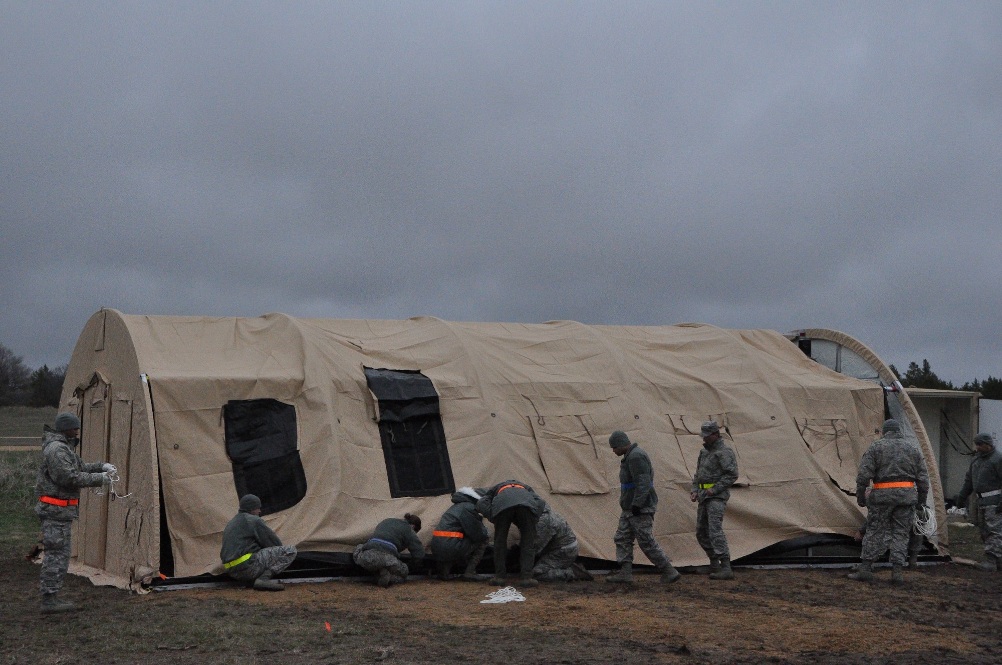 The tent is almost complete as dusk settles in at Fort McCoy, Wisconsin where Air Force Reservists from the 433rd Civil Engineer Squadron help the main body of Exercise Patriot Warrior set up their living areas May 3. Airmen out of Joint Base San Antonio-Lackland arrived here April 26 to bed down a Forward Operating Base and have now moved into the sustainment phase. (U.S. Air Force photo by 1st Lt. Denise Haeussler)