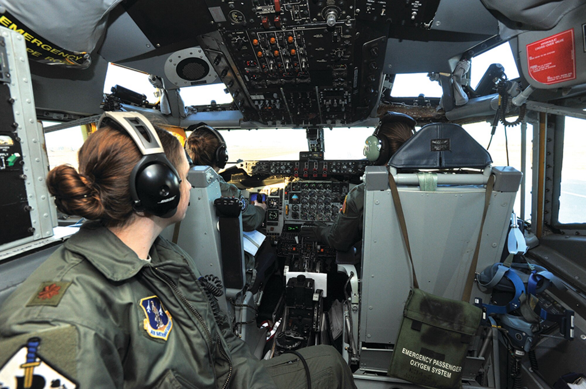 Maj Angela Hauck looks on while Maj Gena Fedoruk and Maj Stephanie Blech prepare for takeoff during a refueling mission at Fairchild Air Force Base, Wash. Hauck is the 116th Air Refueling Squadron director of operations, Fedoruk is the 92d Operations Support Squadron chief of current operations, and Blech is the 92d Operations Group chief of standardization and evaluation.
USAF photo by SSgt Veronica Montes