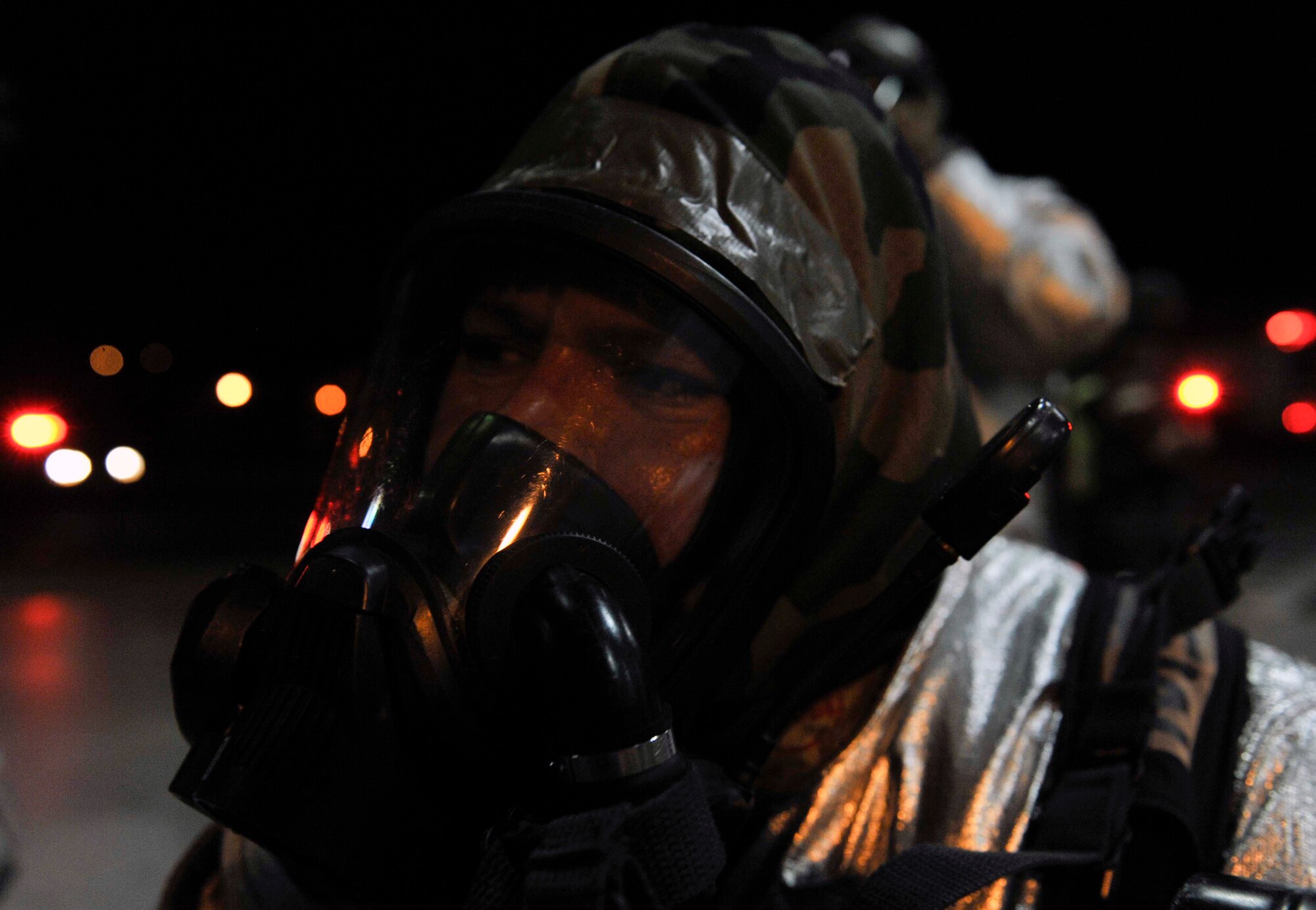Tech. Sgt. Celso Aguilar Moreno, 51st Civil Engineer Squadron, rests as he prepares to take off his gear after clearing the base passenger terminal May 6 during a simulated missile attack scenario on Osan Air Base, Republic of Korea. The scenario caused a fire in the building and turned into a mass casualty event. (U.S. Air Force photo by Senior Airman David Owsianka)