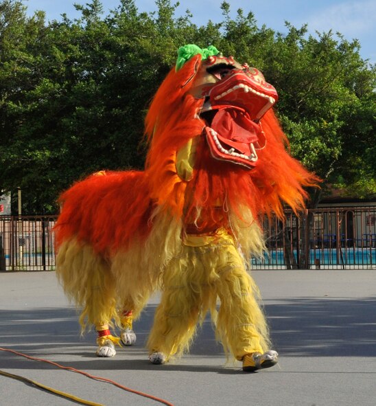 Performers demonstrate a lion dance at the Asian Pacific Heritage-Fest Luau on Barksdale Air Force Base, La., May 2, 2014. A lion dance is performed by two people and is often seen at festivals and celebrations throughout China, Japan and other parts of Asia. (U.S. Air Force photo/Airman 1st Class Benjamin Raughton)