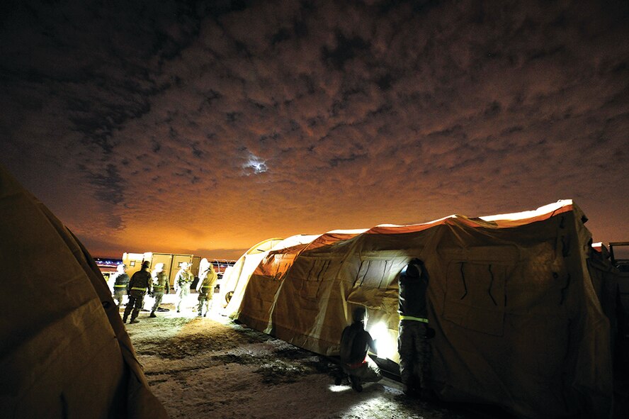 Members of the 621st Contingency Response Wing establish a
campsite while simultaneously beginning mobility operations during
Exercise EAGLE FLAG 14-1, March 2 to 8, 2014. The exercise is
a USAF Expeditionary Center hosted exercise used to execute and
evaluate mobility operations and expeditionary combat support.
USAF photo by TSgt Parker Gyokeres