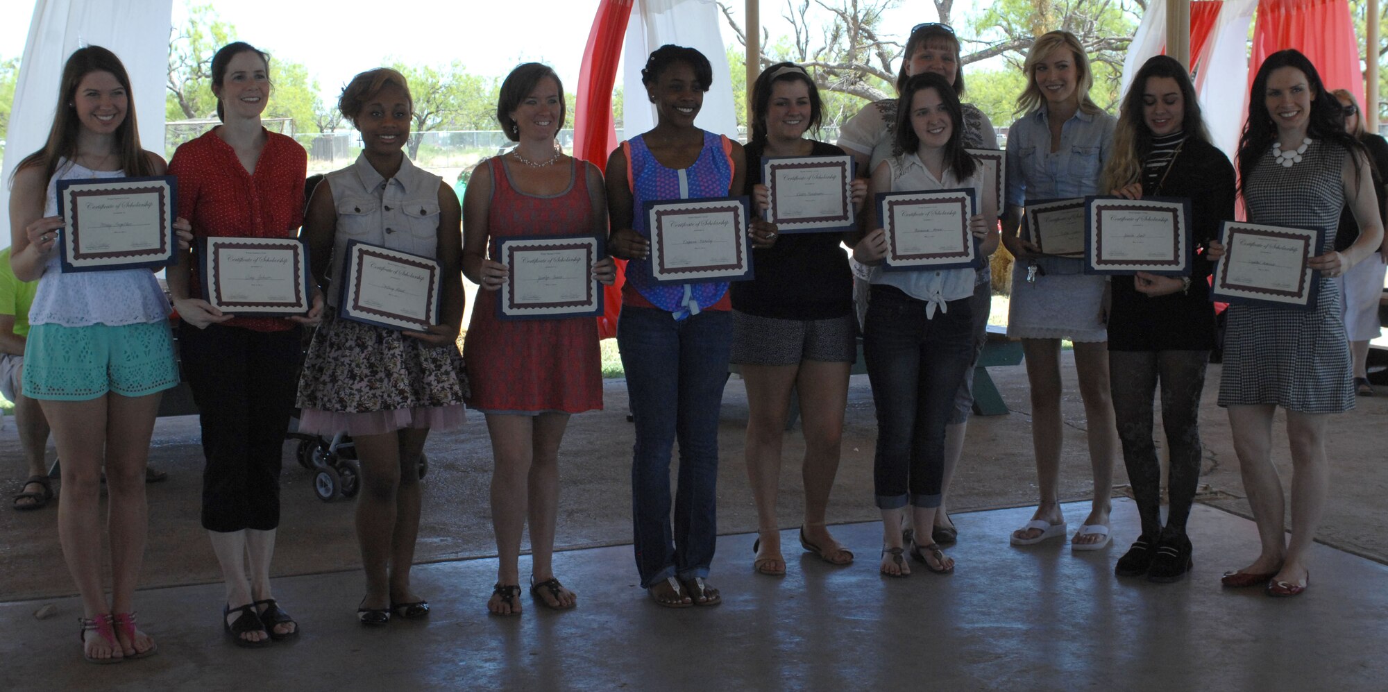 The Dyess Spouses’ Club scholarship award winners were recognized May 3, 2014, at Dyess Air Force Base, Texas. This year the DSC awarded $23,500 in scholarships to 15 military dependents. The DSC is a private volunteer organization that supports Dyess families, as well as local and national charitable organizations through funds generated by the DSC Annual Scholarship auction. (U.S. Air Force photo by Airman 1st Class Kylsee Wisseman/Released) 