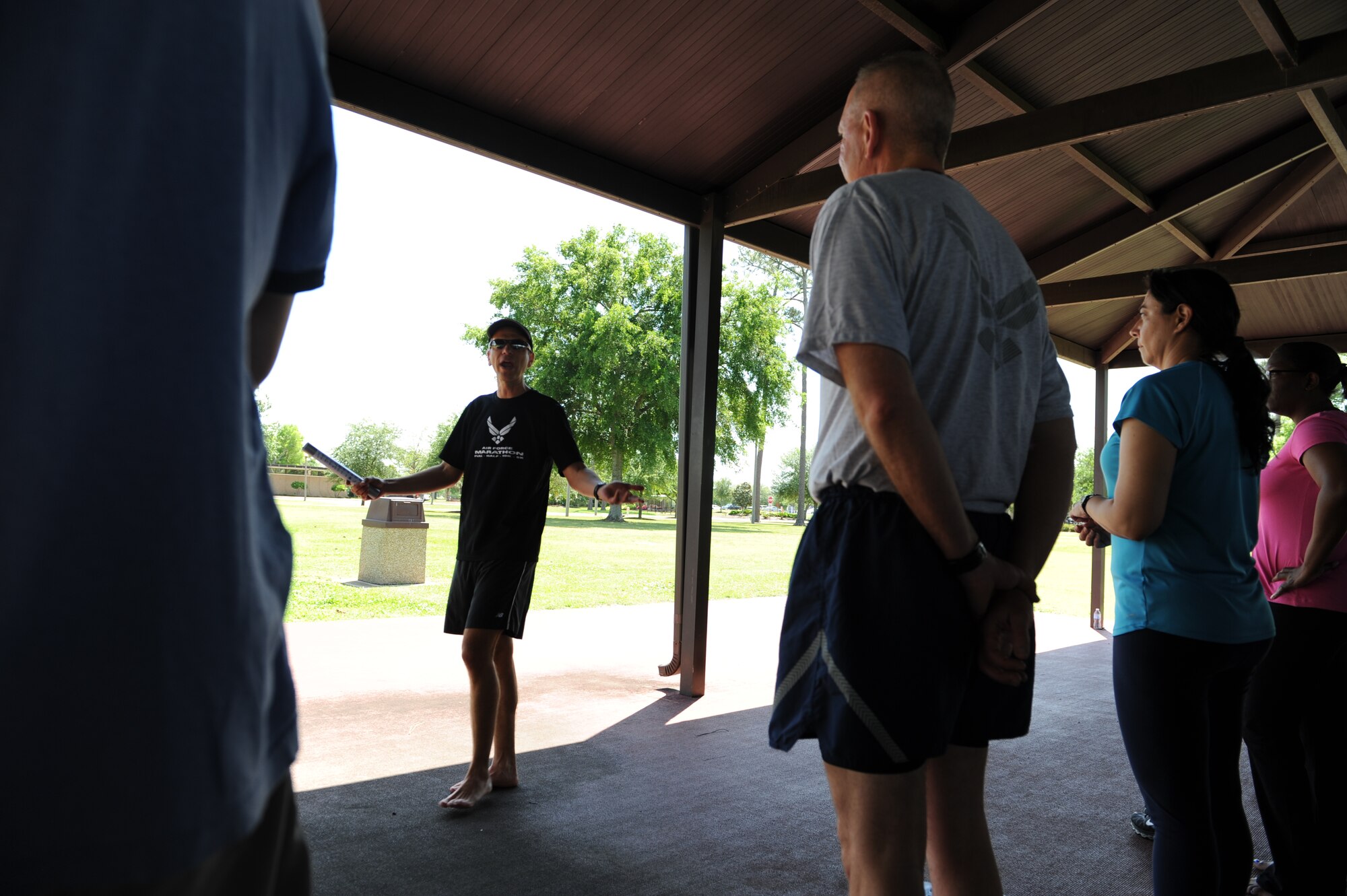 Lt. Col. (Dr.) Antonio Eppolito, chief of Air Force telemedicine, instructs members of Team Keesler in the art and science of becoming a healthier and better runner May 1, at the Crotwell Track, Keesler Air Foce base, Miss. The 81st Aerospace Medicine Squadron health and wellness center hosted the hands-on workshop with Eppolito, a 19-year member of the Air Force Running Team, as the subject matter expert. (U.S. Air Force photo by Airman 1st Class Stephan Coleman)