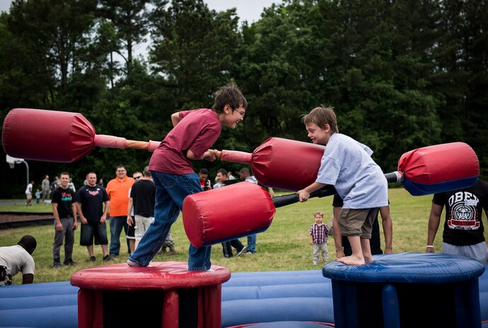 Children participate in a pugil stick battle May 2, 2014, at the Joint Base Charleston picnic. The picnic was a free two-day event which included food, drinks and a live band for all Team Charleston members and their families to enjoy. (U.S. Air Force photo/ Senior Airman Dennis Sloan)