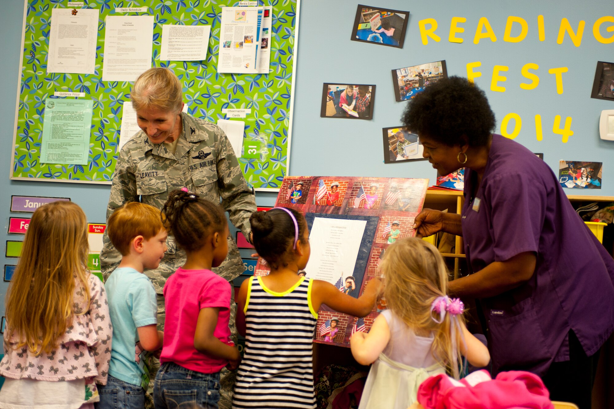 Students from the preschool class at Child Development Center crowd around Col. Jeannie Leavitt, 4th Fighter Wing commander, during a visit May 2, 2014 at Seymour Johnson Air Force Base, N.C. Each student thanked Leavitt for helping make Child Abuse Prevention Month a success. (U.S. Air Force photo by Staff Sgt. Michael Charles)