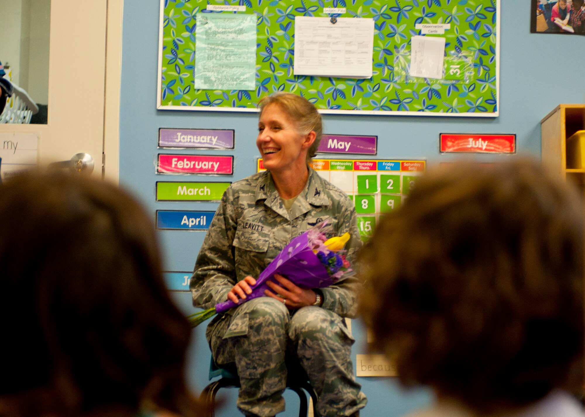 Col. Jeannie Leavitt, 4th Fighter Wing commander, talks with the Child Development Center preschool class, May 2, 2014, at Seymour Johnson Air Force Base. The class presented Leavitt with a bouquet of flowers and a mural in appreciation for her participation in Child Abuse Prevention Month. Leavitt signed a proclamation in April reinforcing Team Seymour’s commitment to helping children who have been abused. (U.S. Air Force photo by Staff Sgt. Michael Charles)
