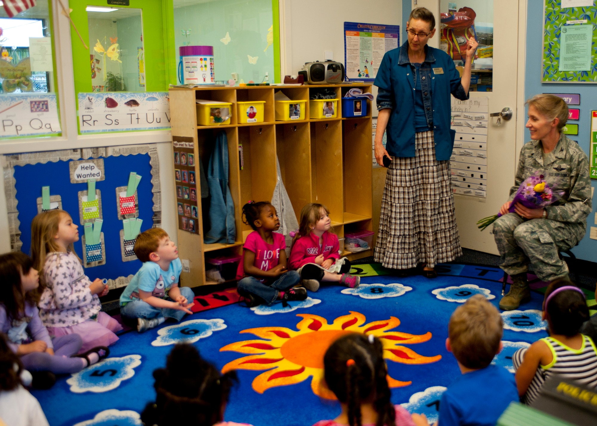 Students from the preschool class at the Child Development Center show their appreciation to Col. Jeannie Leavitt, 4th Fighter Wing commander, during a visit, May 2, 2014, at Seymour Johnson Air Force Base, N.C. She was recognized for her participation in Child Abuse Prevention Month. Leavitt, along with key members of the Goldsboro, N.C., community helped kick-off the annual observation in April to promote child well-being. (U.S. Air Force photo by Staff Sgt. Michael Charles)