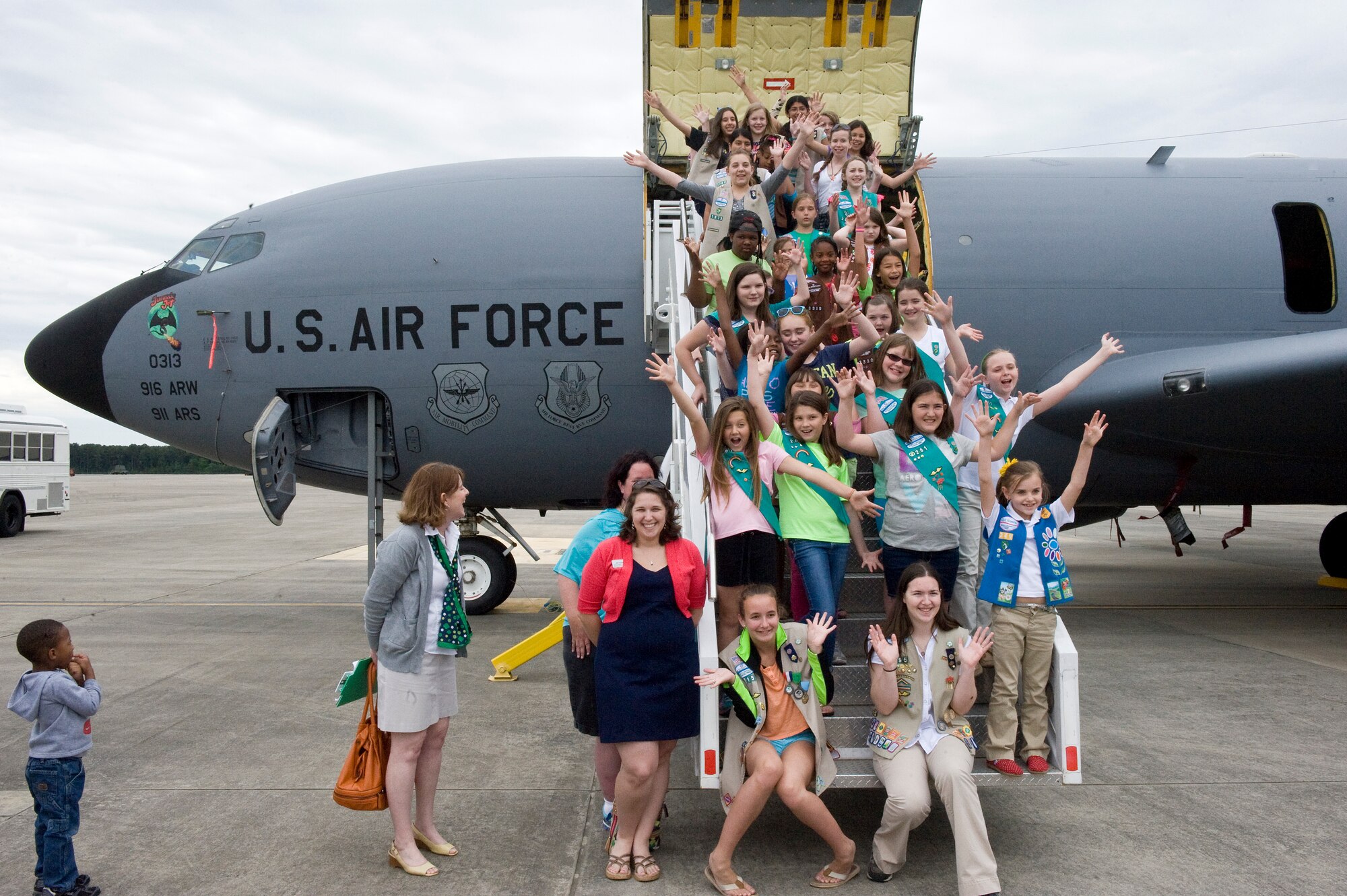A group of Girl Scouts from eastern North Carolina visits the flightline, May 2, 2014, at Seymour Johnson Air Force Base, N.C. The local troops donated 11 pallets of assorted cookies to the 916th Air Refueling Wing to help increase morale of service members who are deployed overseas in support of contingency operations. *Girl Scouts of America is a private organization and has no governmental status. The appearance of this photo does not constitute endorsement by the U. S. Government or the U. S. Air Force. (U.S. Air Force photo/Airman 1st Class Aaron J. Jenne)