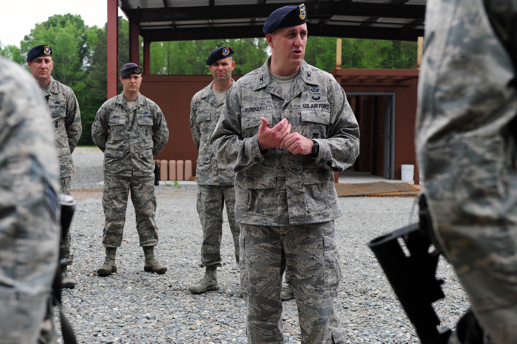Col. Erik Rundquist, Director of Security Forces, Headquarters Air Combat Command, speaks with Airmen from the 4th Security Forces Squadron after an exercise, April 29, 2014, at Seymour Johnson Air Force Base, N.C. Rundquist visited the 4th SFS to observe first-hand operations and procedures the Airmen perform daily. (U.S. Air Force photo/Senior Airman John Nieves Camacho)