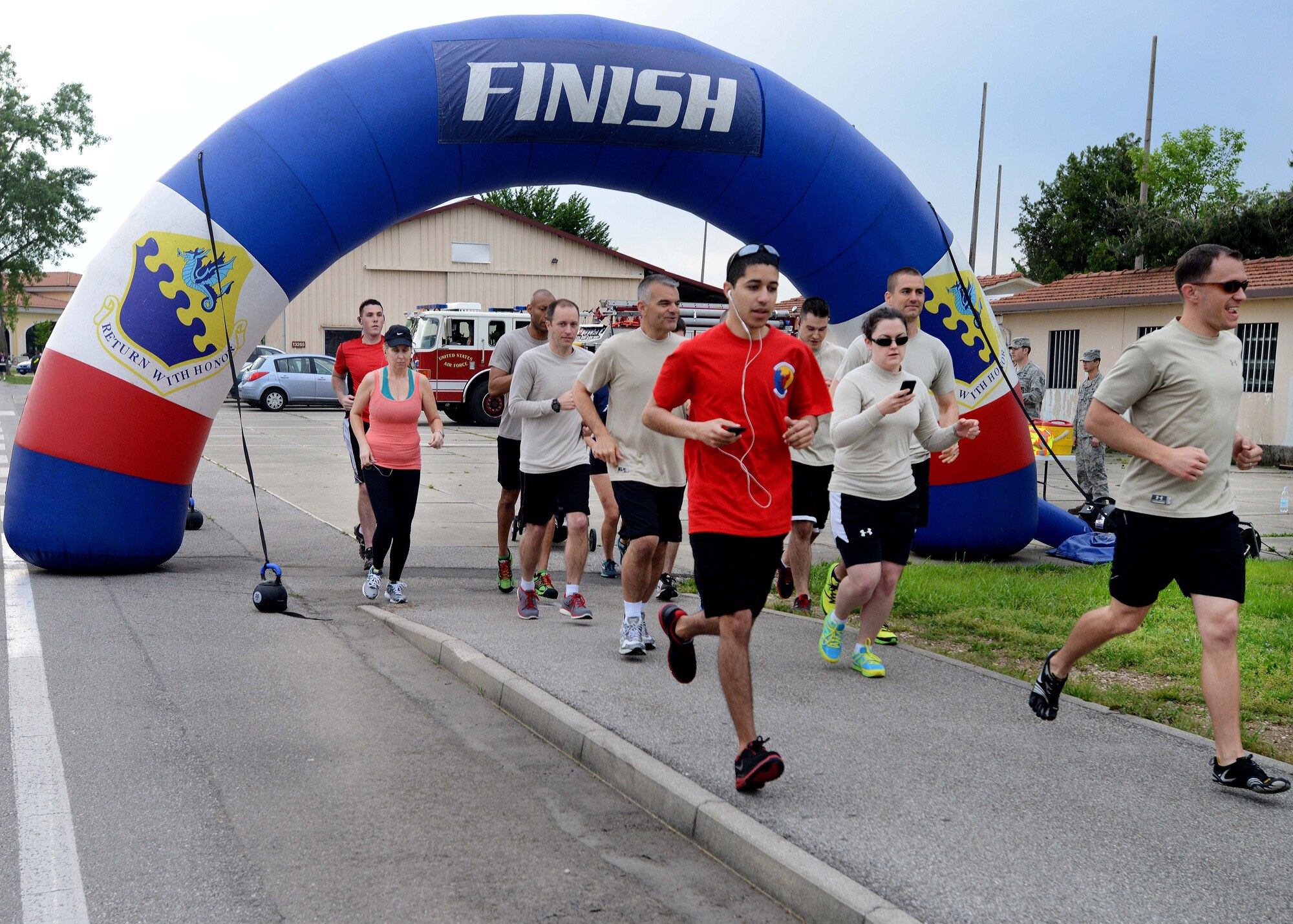 Team Aviano members participate in a memorial six kilometer run during the Holocaust Days of Remembrance week, May 2, 2014, at Aviano Air Base, Italy. The memorial run was held in honor of the more than 6 million Jews and millions of others who died during the reign of the Nazi Party throughout World War II. (U.S. Air Force photo/Airman 1st Class Deana Heitzman)