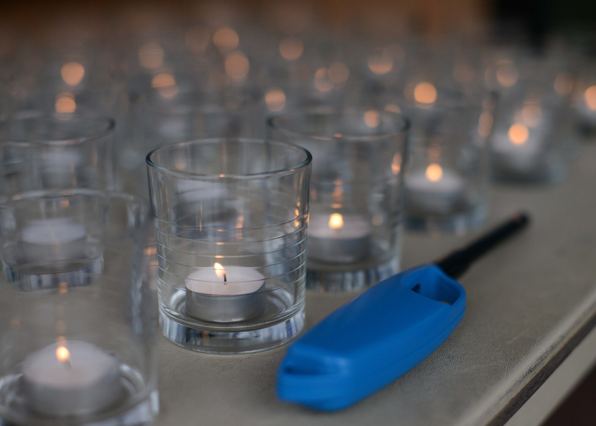 Lit candles are displayed during a candlelight vigil during the Holocaust Days of Remembrance week, April 28, 2014, at Aviano Air Base, Italy. More than 11 million people were murdered by the Nazi Party between the years of 1933 and 1945. (U.S. Air Force photo/Airman 1st Class Deana Heitzman)
