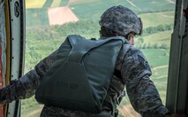 U.S. Air Force Staff Sgt. Jonathan Smith, 435th Security Forces Squadron jumpmaster, scans a landing zone in preparation for aerial disembarkments inside a C-130J Super Hercules as part of International Jump Week over Germany May 5, 2014. A total of 97 foreign and allied partners tested, built and strengthened partnerships during jump week alongside American Airmen and Soldiers. (U.S. Air Force photo/Airman 1st Class Jordan Castelan)