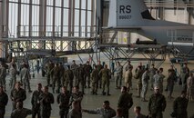 American Service Member parachutists, and parachutists from eight visiting countries, prepare to board a C-130J Super Hercules as part of International Jump Week on Ramstein Air Base, Germany, May 5, 2014. A total of 97 foreign and allied partners tested, built and strengthened partnerships during jump week alongside American Airmen and Soldiers. (U.S. Air Force photo/Airman 1st Class Jordan Castelan)