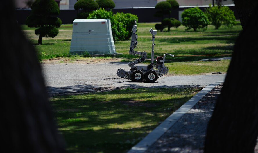 An Explosive Ordnance Disposal robot rolls on scene to a suspicious package exercise at Kunsan Air Base, Republic of Korea, May 6, 2014. The EOD robot supports the wings mission by allowing Airmen to get close to objectives without risking a life. The wing inspection team kept constant injects rolling in, keeping Airmen’s readiness razor sharp. (U.S. Air Force photo by Senior Airman Armando A. Schwier-Morales/Released)