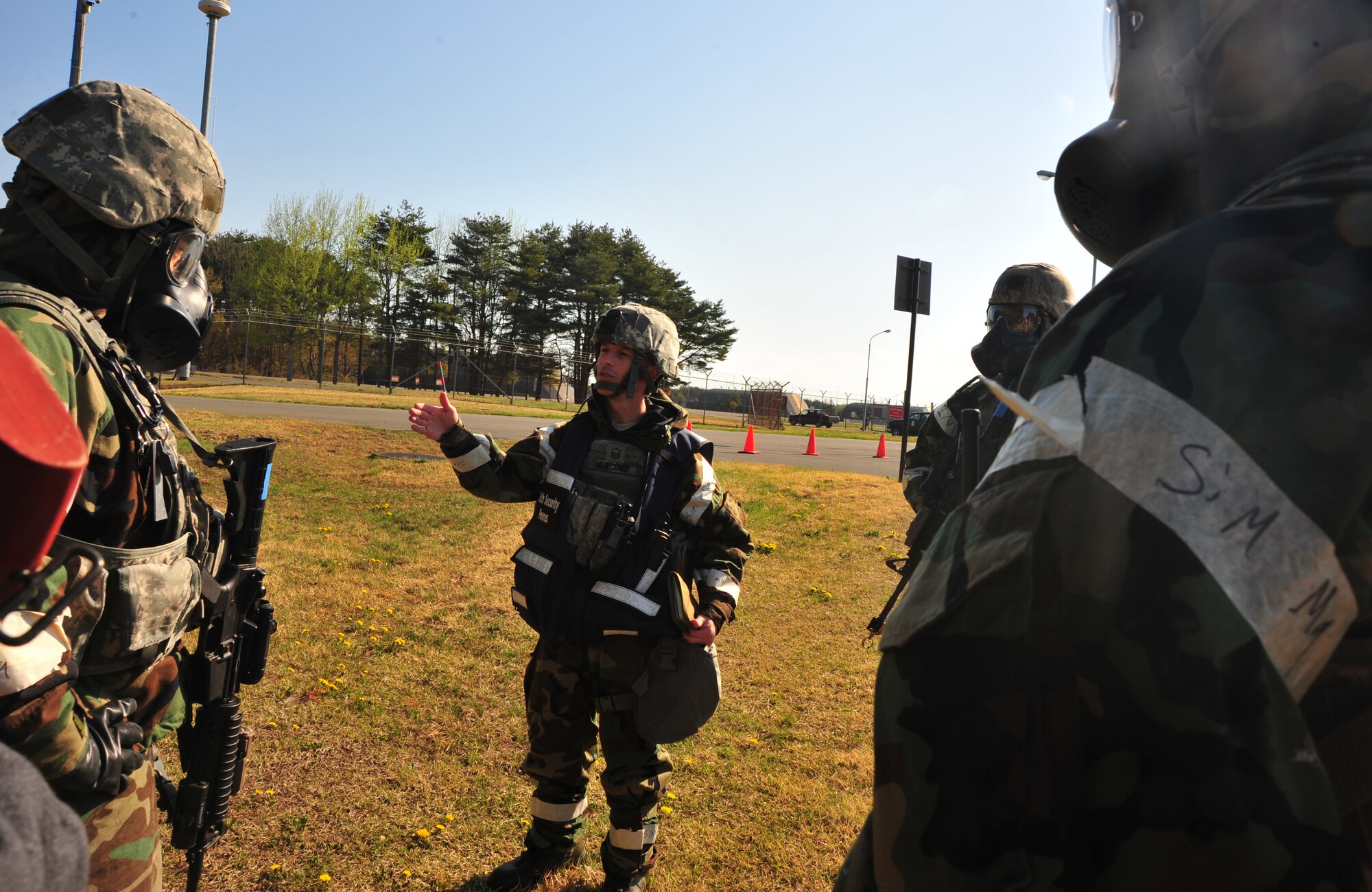 U.S. Air Force Master Sgt. William Newcomb, 35th Security Forces Squadron NCO in charge of standards and evaluation, conducts a post brief of the ground attack scenario with security forces entry controllers during an Operational Readiness Squadron at Misawa Air Base, Japan, May 6, 2014. Newcomb provided feedback and guidance regarding the actions taken during this security situation. (U.S. Air Force photo/Senior Airman Jose Hernandez-Domitilo)